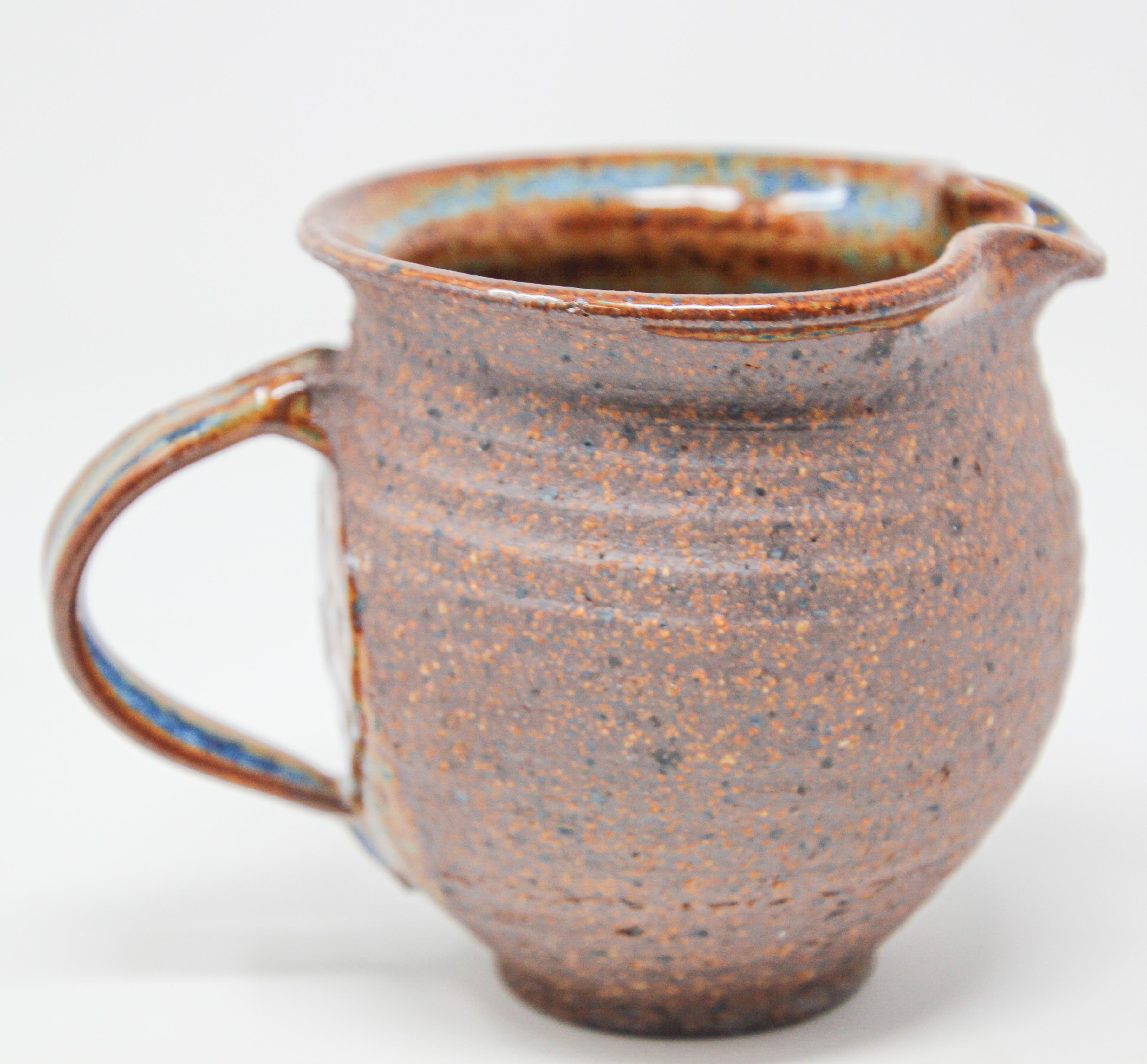 Vintage American hand thrown art Pottery Jug Artisan stoneware
This is a vintage handcrafted American studio art Pottery blue glazed small pitcher.
Superb pottery jug immaculate hand thrown studio ceramics artisan stoneware.
It is beautifully glazed