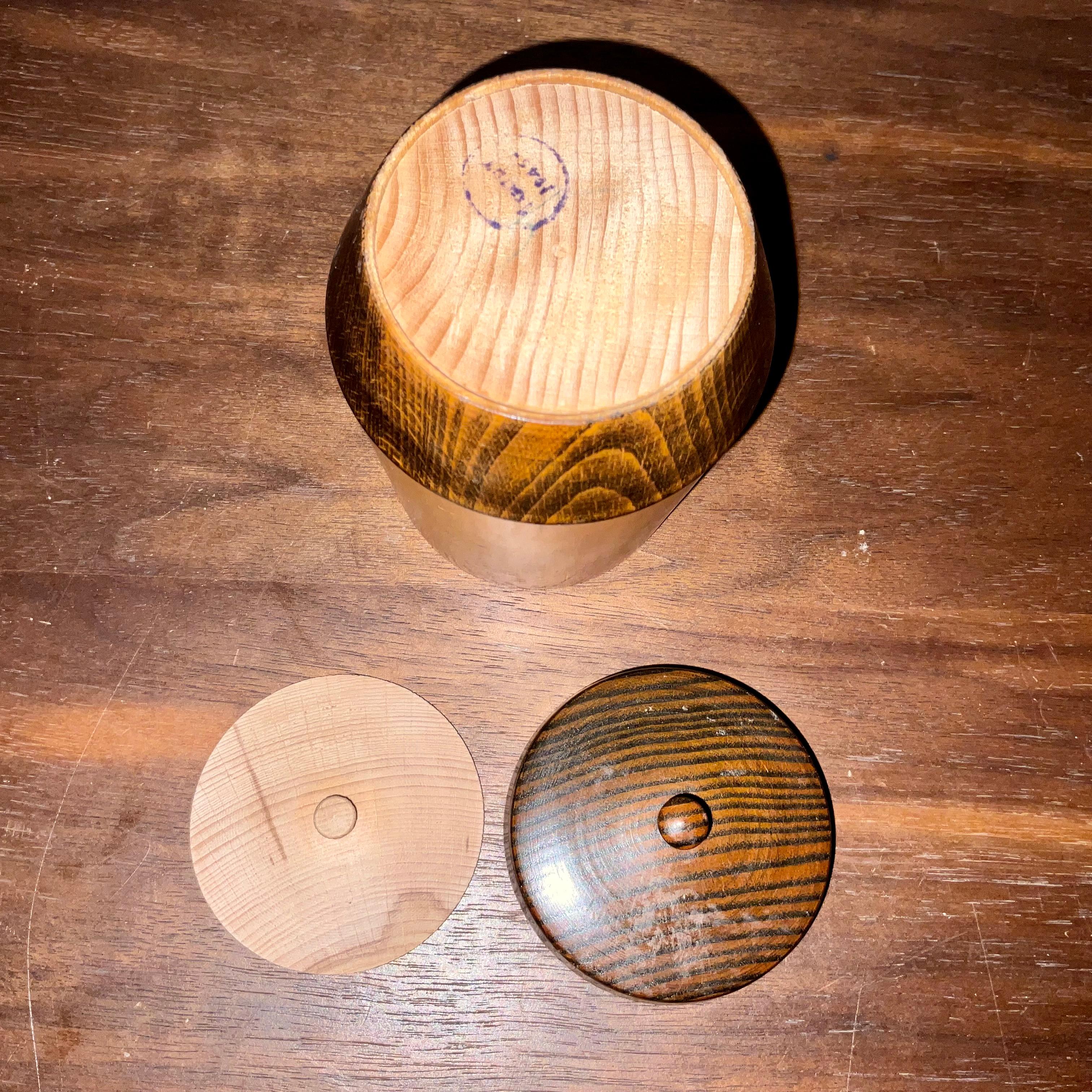 Vintage Hand-Turned Lidded Box (1945) with Interior Lid

**Description:** This exquisite hand-turned lidded box, dated 1945, is a beautiful example of mid-20th century woodworking artistry. Standing 5 inches tall and 3 inches wide, the box features