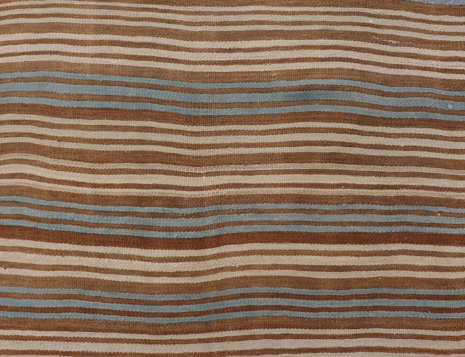 Vintage Turkish Kilim Hand Woven with stripes with brown, blue and cream. Keivan Woven Arts / rug EN-P13763, country of origin / type: Turkey / Kilim, circa Mid-20th Century.

Measures: 4'5 x 10'0.