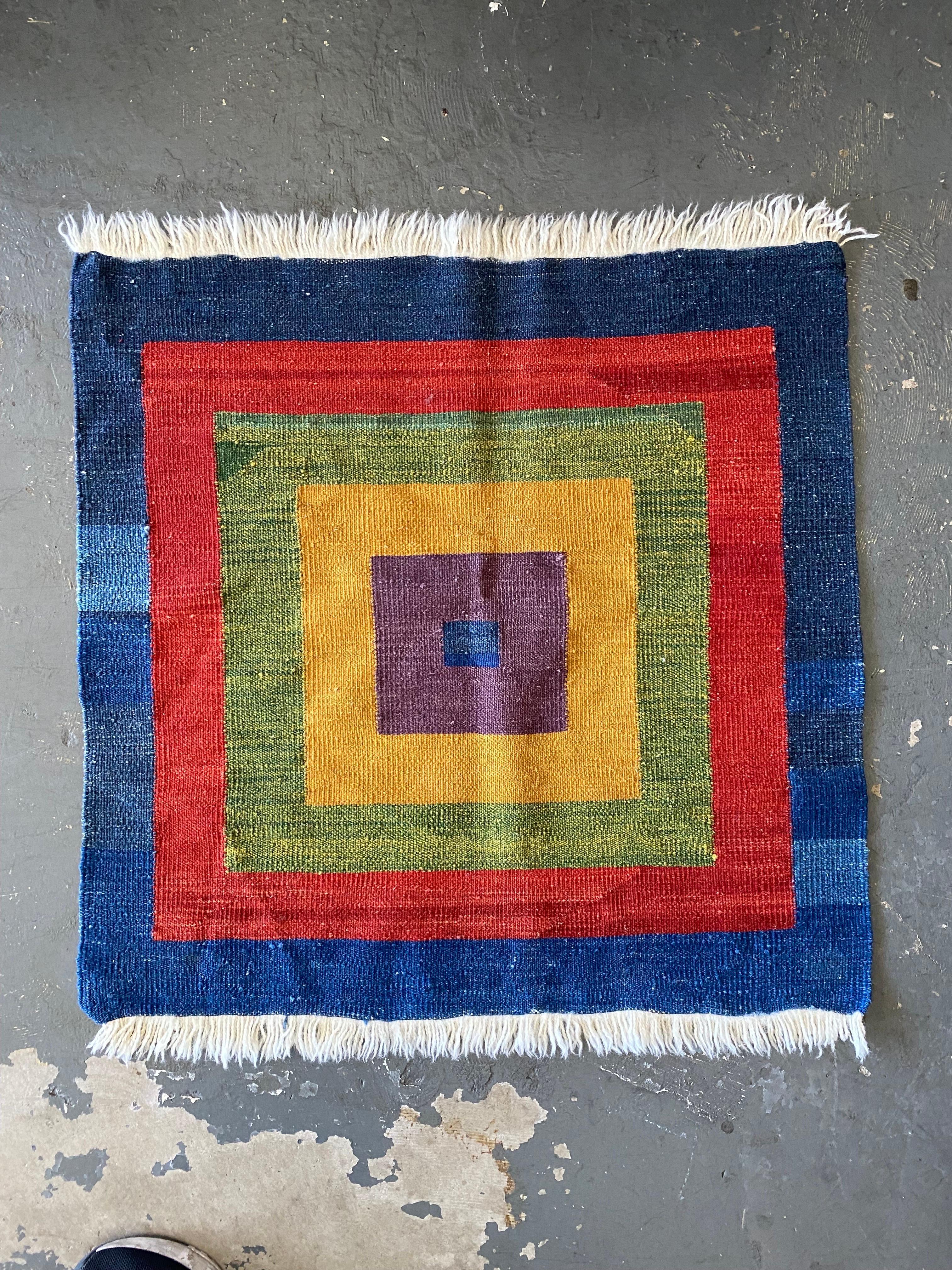 Beautiful Navajo style square rug or tapestry in excellent condition. Perfect to use as a rug in your entry hall, office or where you please. Or use it as a tablecloth or hang it up as wall decoration. 

This wool fabric tapestry is in excellent