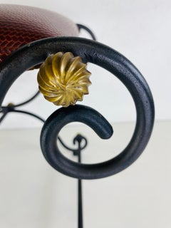 Vintage hand wrought iron and leather bench.