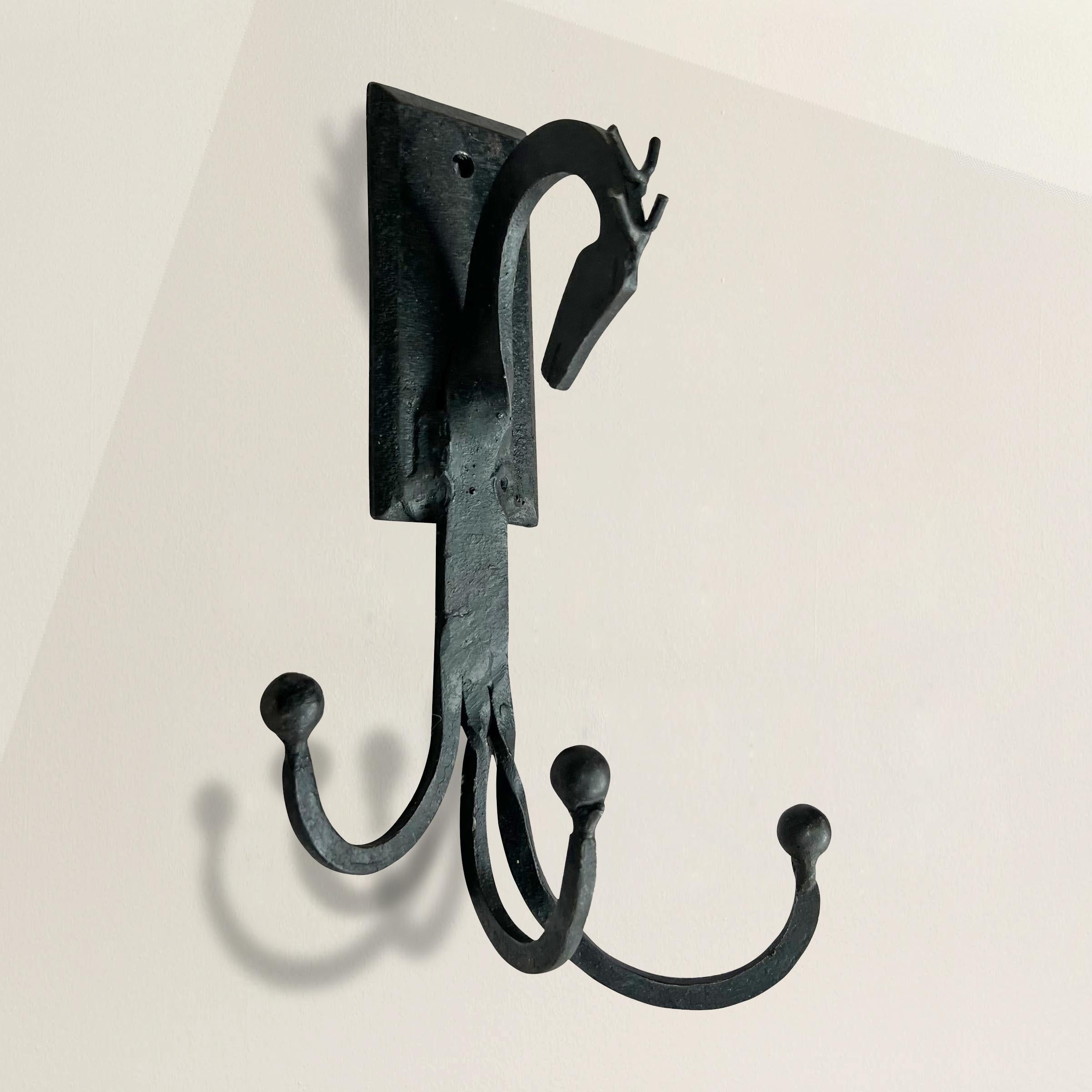 Add a touch of vintage charm and practicality to your space with this exquisite American hand-wrought iron wall hook. Crafted with artistry and attention to detail, this wall hook features a unique horse-head finial that adds a whimsical element to