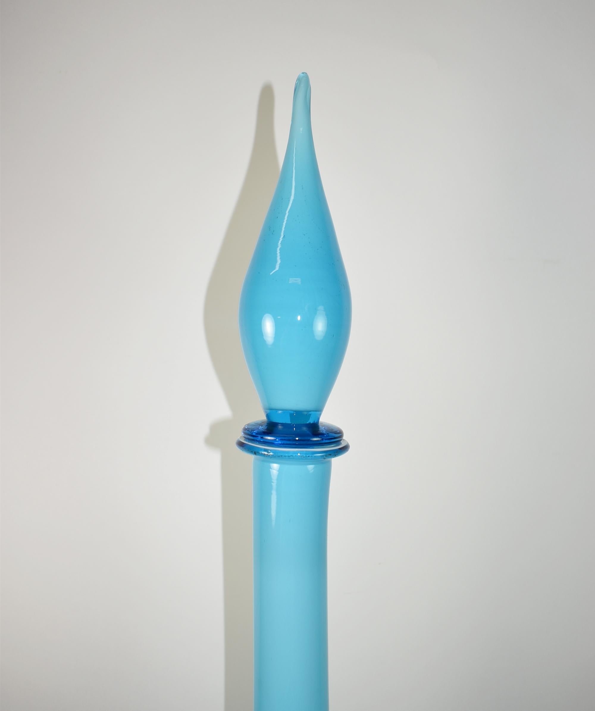 Vintage aqua blue hand blown glass, Empoli Italian decanter, genie style, Murano, Mid-Century. White interior with blue cased glass with a teardrop stopper. Very good condition with light scratch on edge of bottom face. Dimensions: 27