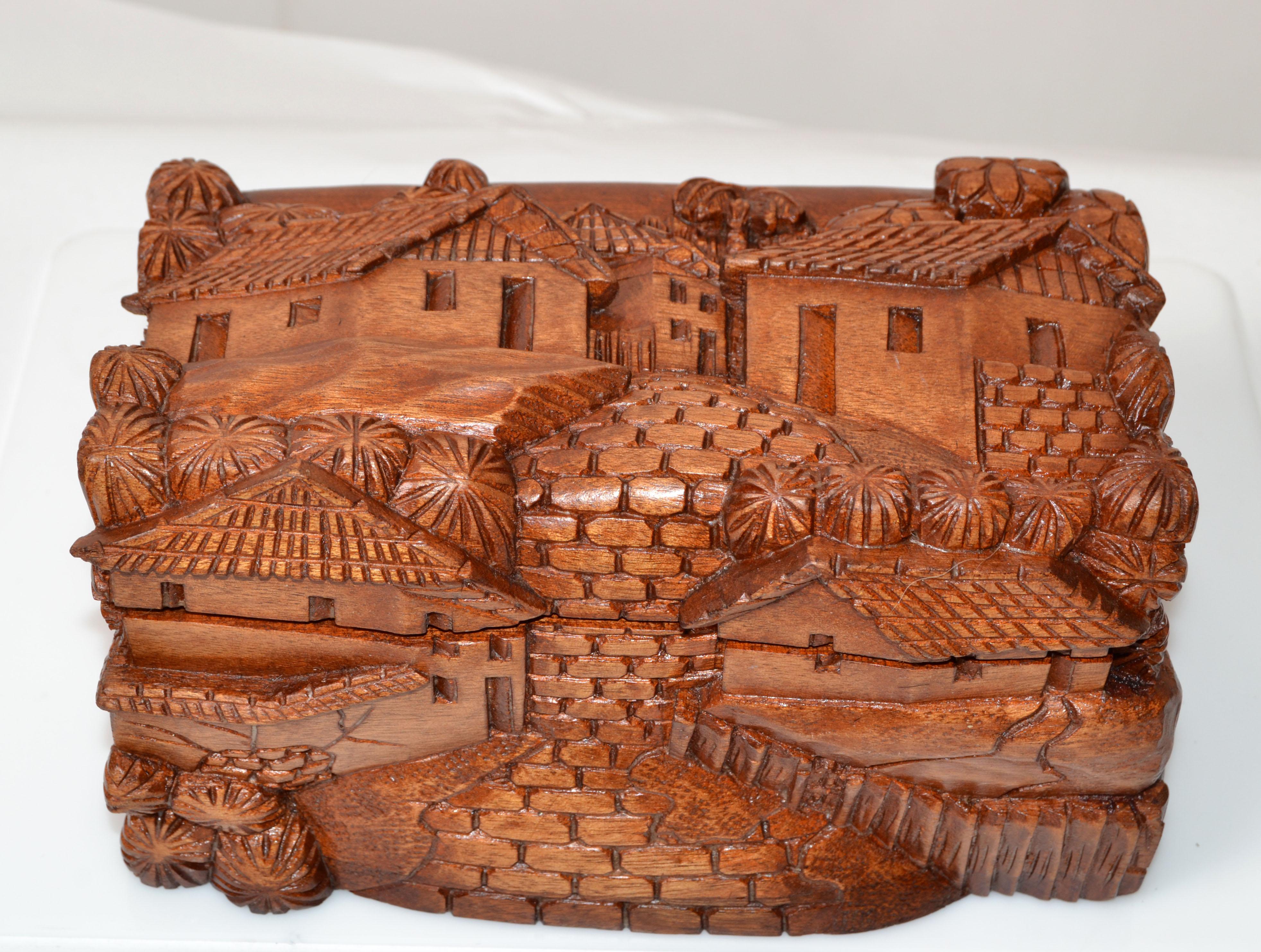 Vintage handmade beautifully carved wooden trinket box, jewelry box or keepsake box.
Depicting a village scene with Houses & Palm Trees.
Folk Art handmade in South America. No makers mark.
 