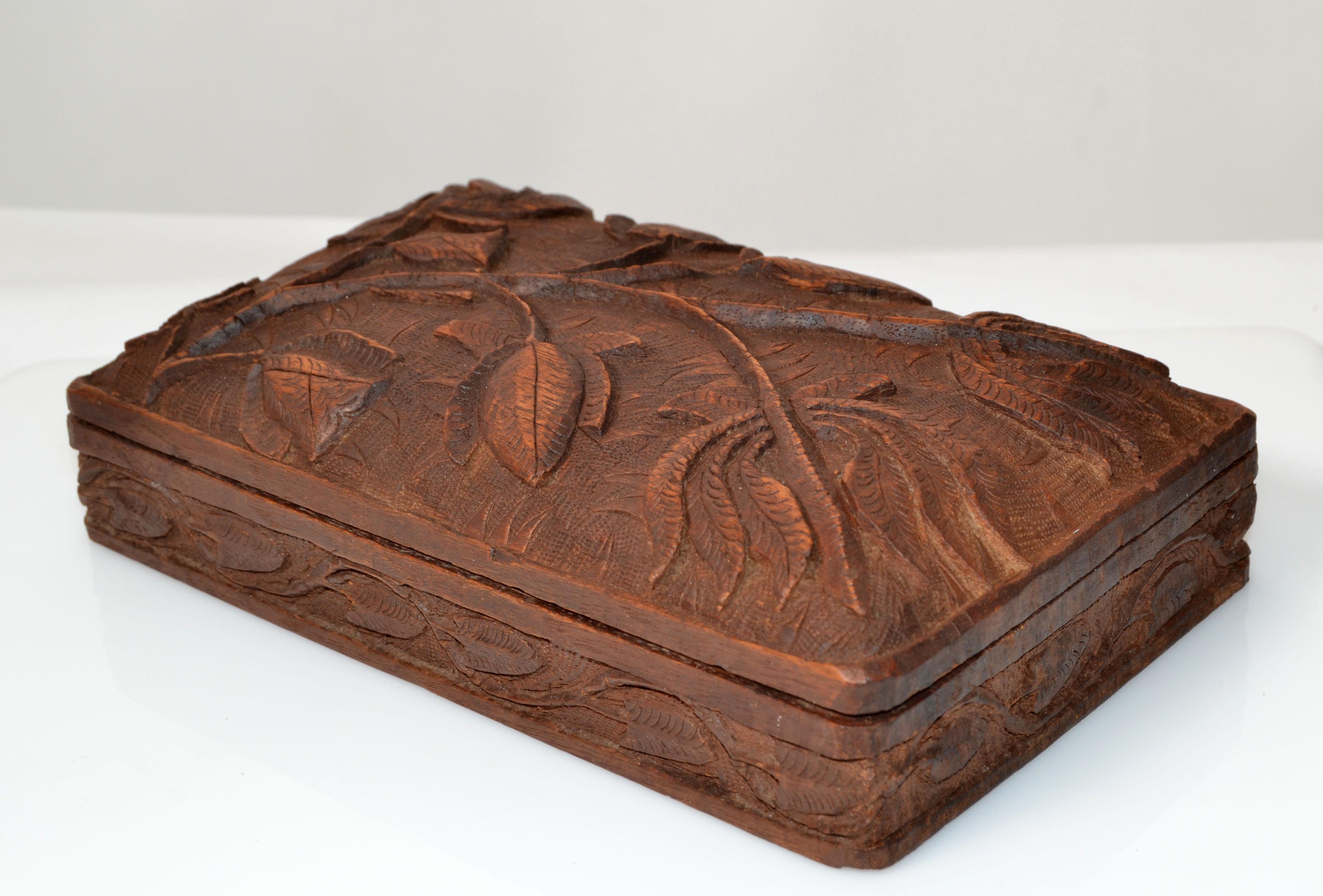 Vintage handmade beautifully carved wooden box, jewelry box or keepsake box.
The Inside has 2 compartments which measure 3.38 x 3.38 inches. 
No makers mark.
 