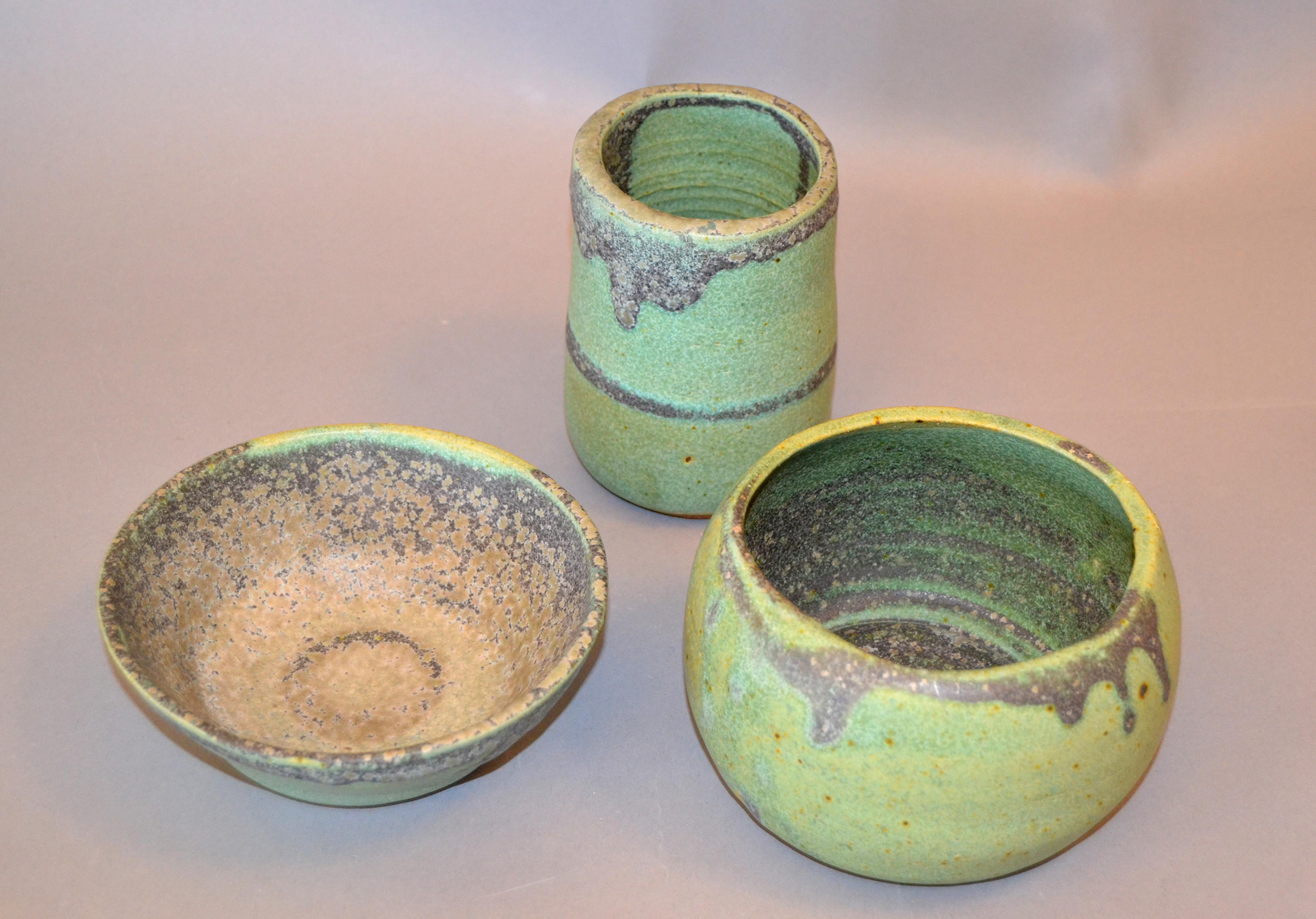 Set of 3 vintage handcrafted Aztec green, gray and brown group of pottery bowls, vessel.
Makers mark underneath, NG.
Dimensions:
Flat bowl diameter 6 inches, height 2.25 inches;
Tall small bowl diameter 3.75 inches, height 5 inches;
Bowl