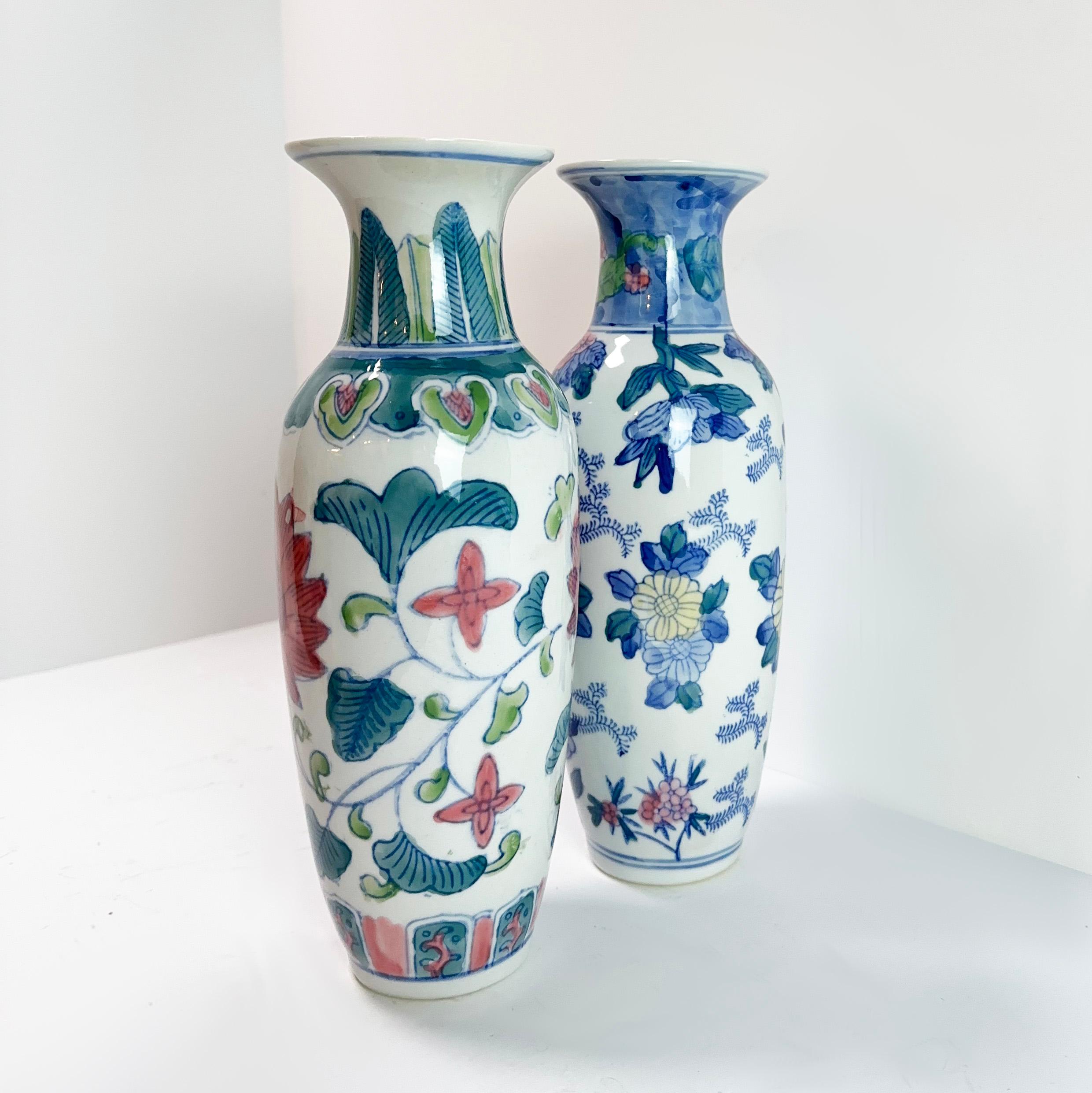 Embrace the charm of these small, mismatched Chinese porcelain vases, likely crafted in the 1980s. While the maker remains unknown, as the vases are unstamped, their allure is unmistakable. 

Made from porcelain and coloured glaze, these vases