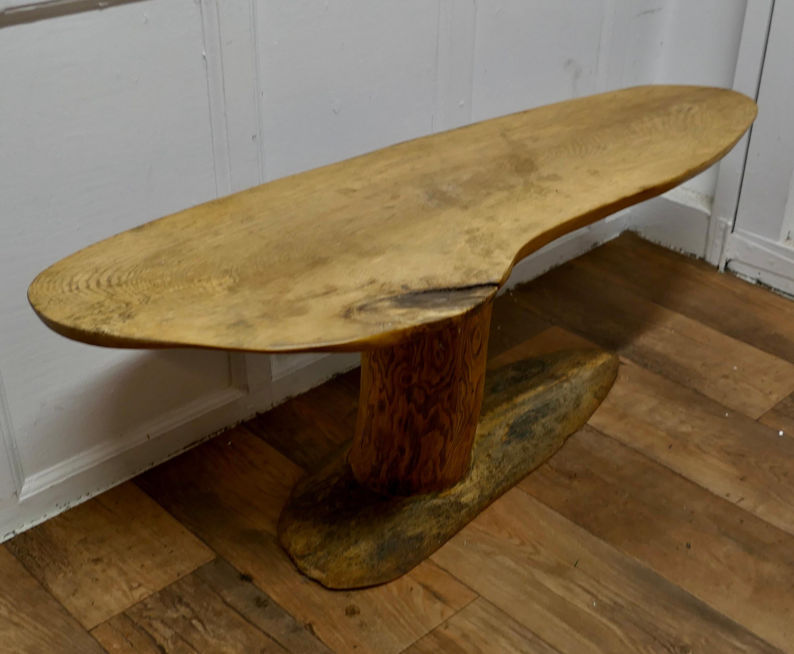 Vintage Handcrafted Freeform Live Edge Solid Plank Elm Coffee Table 

No other one like this, it has the appearance off a free form drift wood surf board. The table top is one plank and the pedestal support is a single trunk in Burr Elm, this makes
