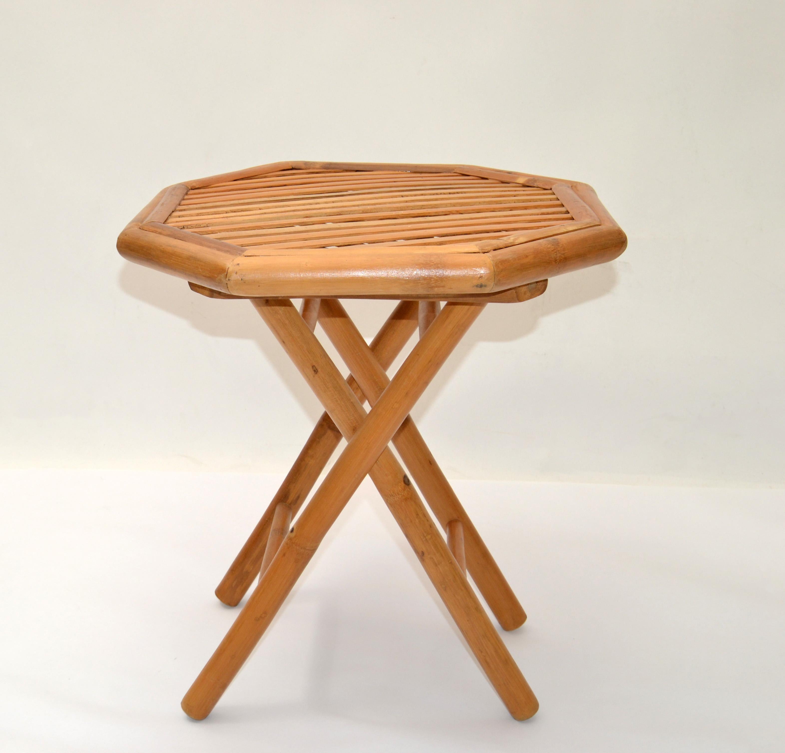 1970s Mid-Century Modern handcrafted and handwoven octagonal bamboo foldable side table.
Decorative and sturdy X base.
The table is easy to fold and uses a small storage place.
Measurement folded:
18 x 6 x 34.25 height.