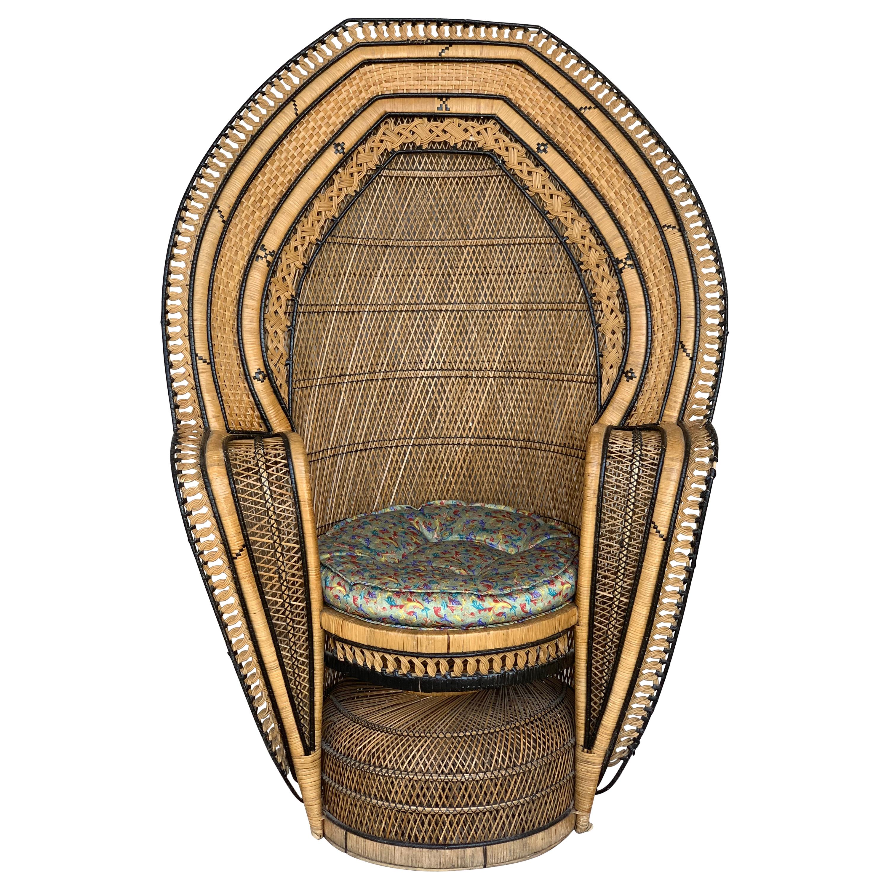 Stunning handwoven vintage peacock chair from the 1970s.
Please note the details and different techniques in this chair. 
Made out of wicker, rattan and reed.
Great for indoor and outdoor use.

Measures: Seat and cushion diameter 21in.