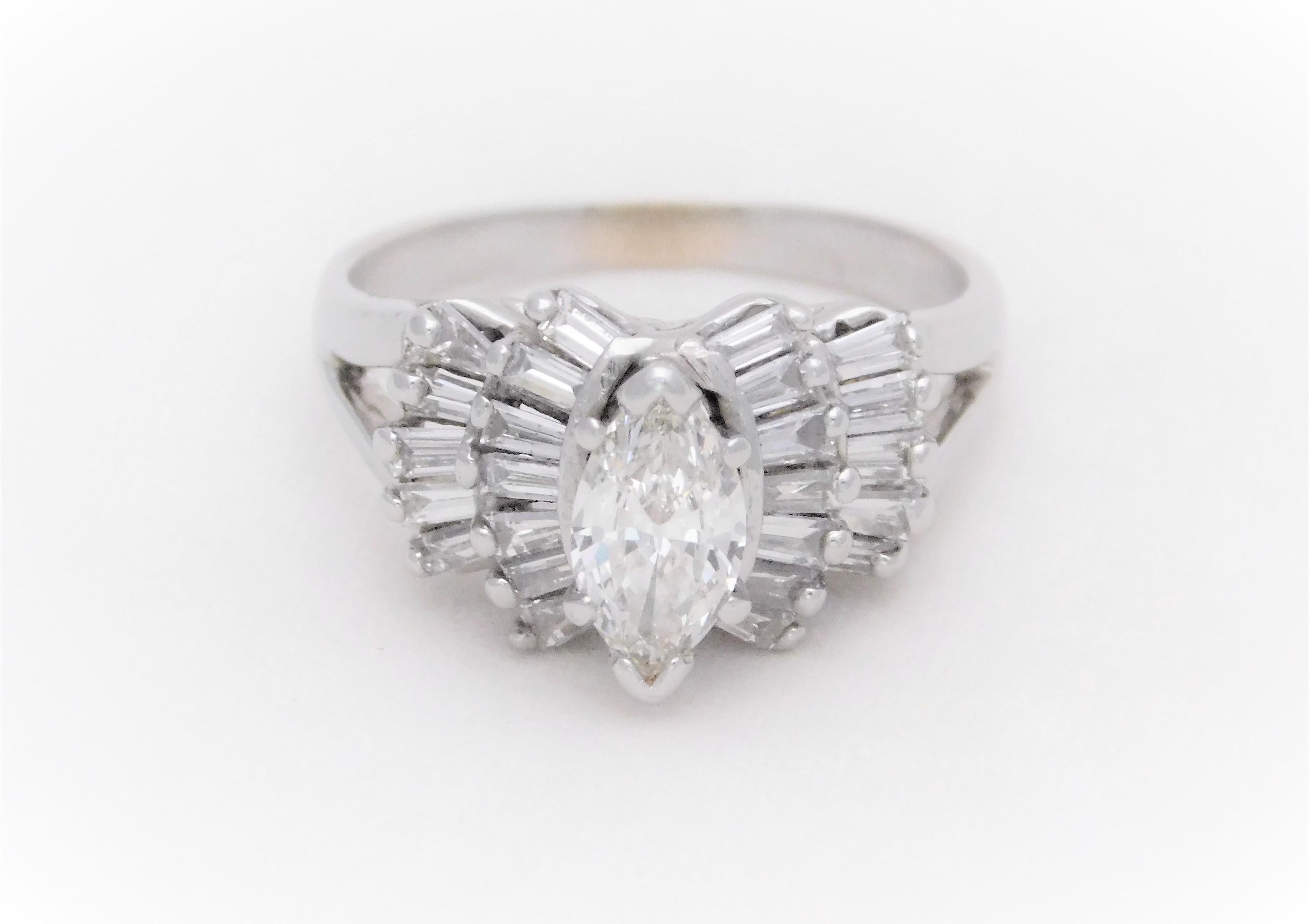From a delightful Southern estate.  This cocktail-style ring has been crafted in solid 14k white gold.  The design is an elegant take on a vintage dinner ring.  It features an immaculate natural marquise-cut diamond, approximating 0.75ct, as its