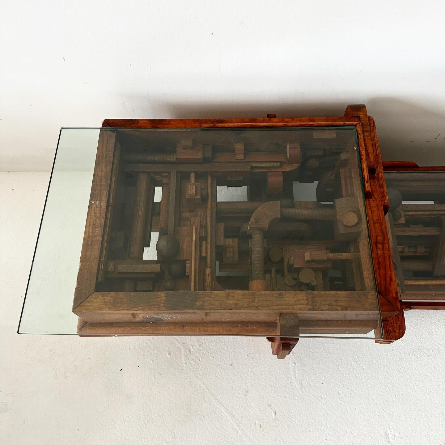 vintage handmade, bi-level low coffee table. Solid wood with glass tops -- resemembles Louise Nevelson with found wood pieces collaged into an assembly that's part steampunk part organic.