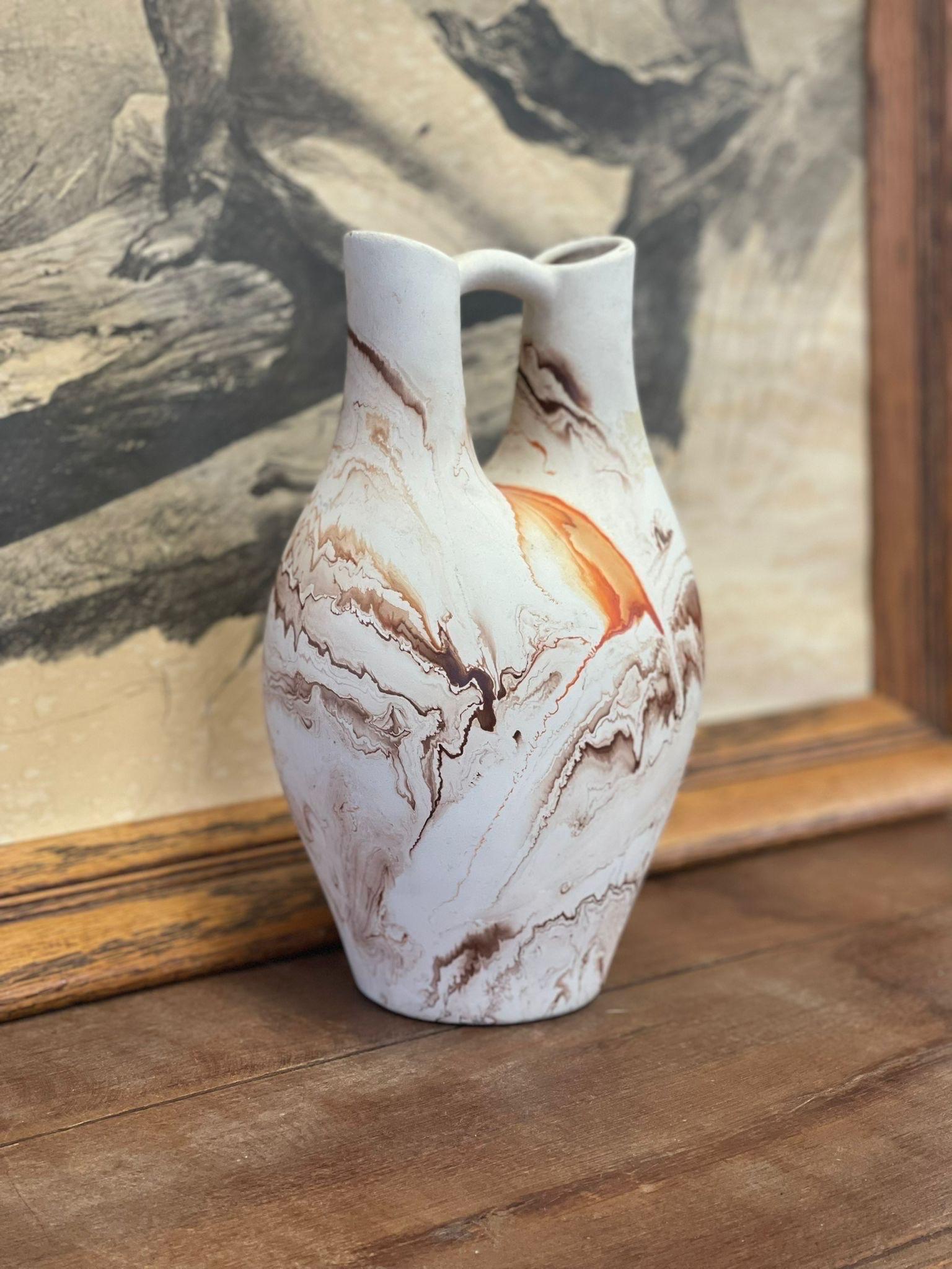 Vintage Handmade Double Spout Nemadji Vase Minnesota Multicolored Stamped ceramic vase antique pottery orange and blue designed decor

Dimensions. 6 W ; 4 1/2 D ; 10 H