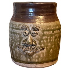 Vintage Handmade glaze pottery with abstract face.