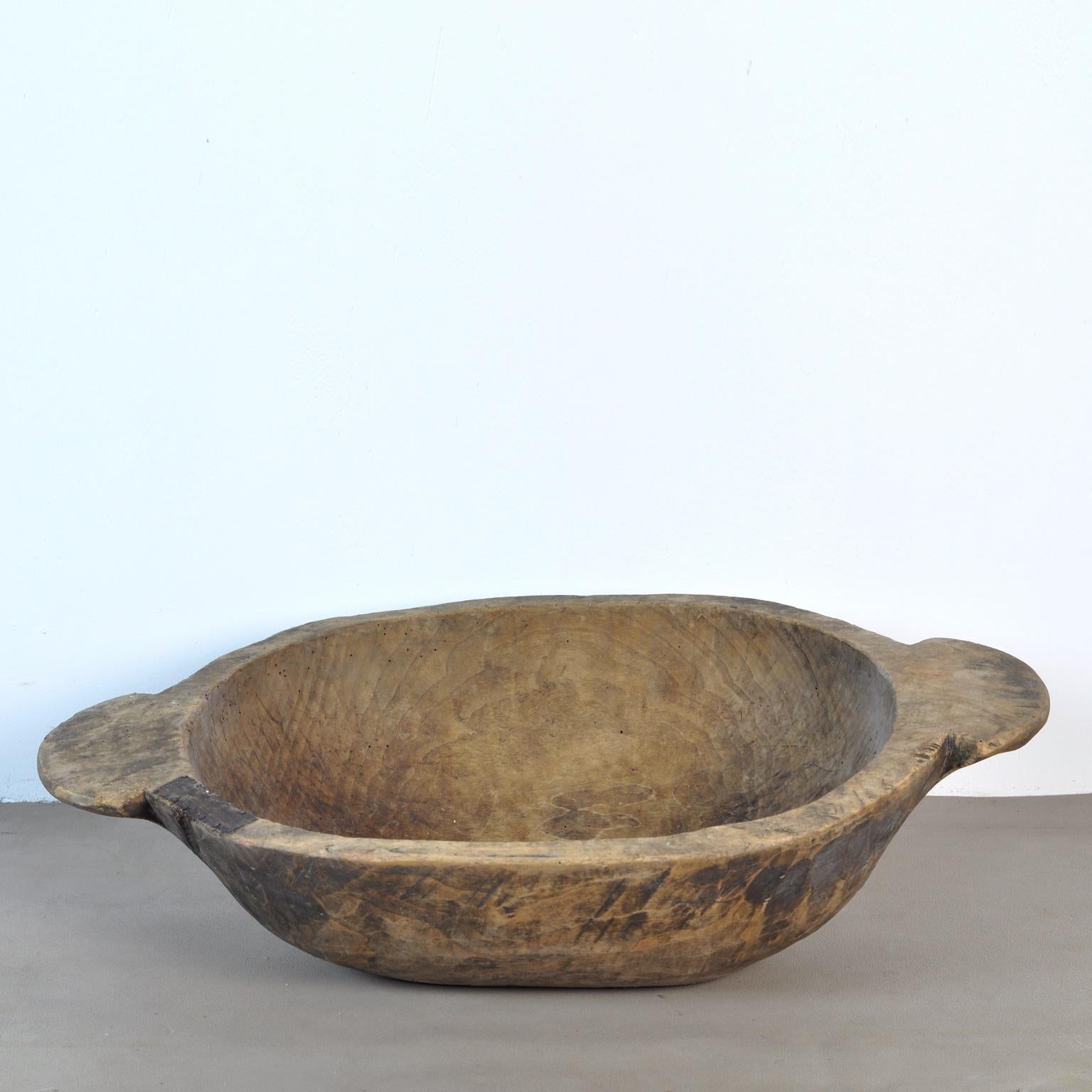Beautiful hand carved Hungarian dough bowl, 1930s
In good rustic condition. As with all vintage items there will be signs of wear and tear from use over the years.
2 repairs have been done in the past with small pieces of metal to reinforce the
