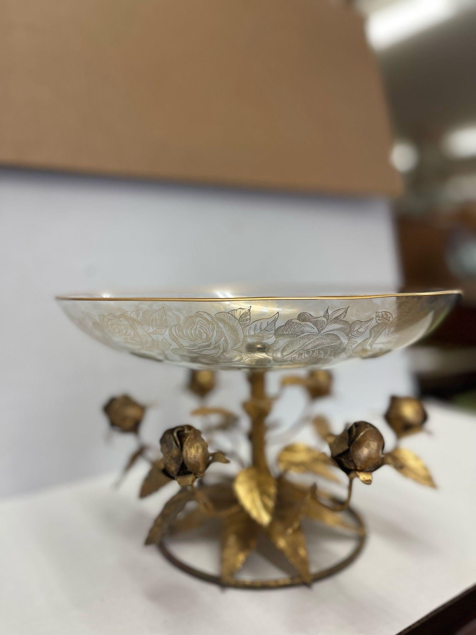 Intricate detailing on the gift mental base, roses wrapped around. These are reflected in the gold toned rose motif wrapping around the edges of the Bowl. Vintage Condition Consistent with Age as Pictured.

Dimensions. 11 1/2 Diameter ; 7 H