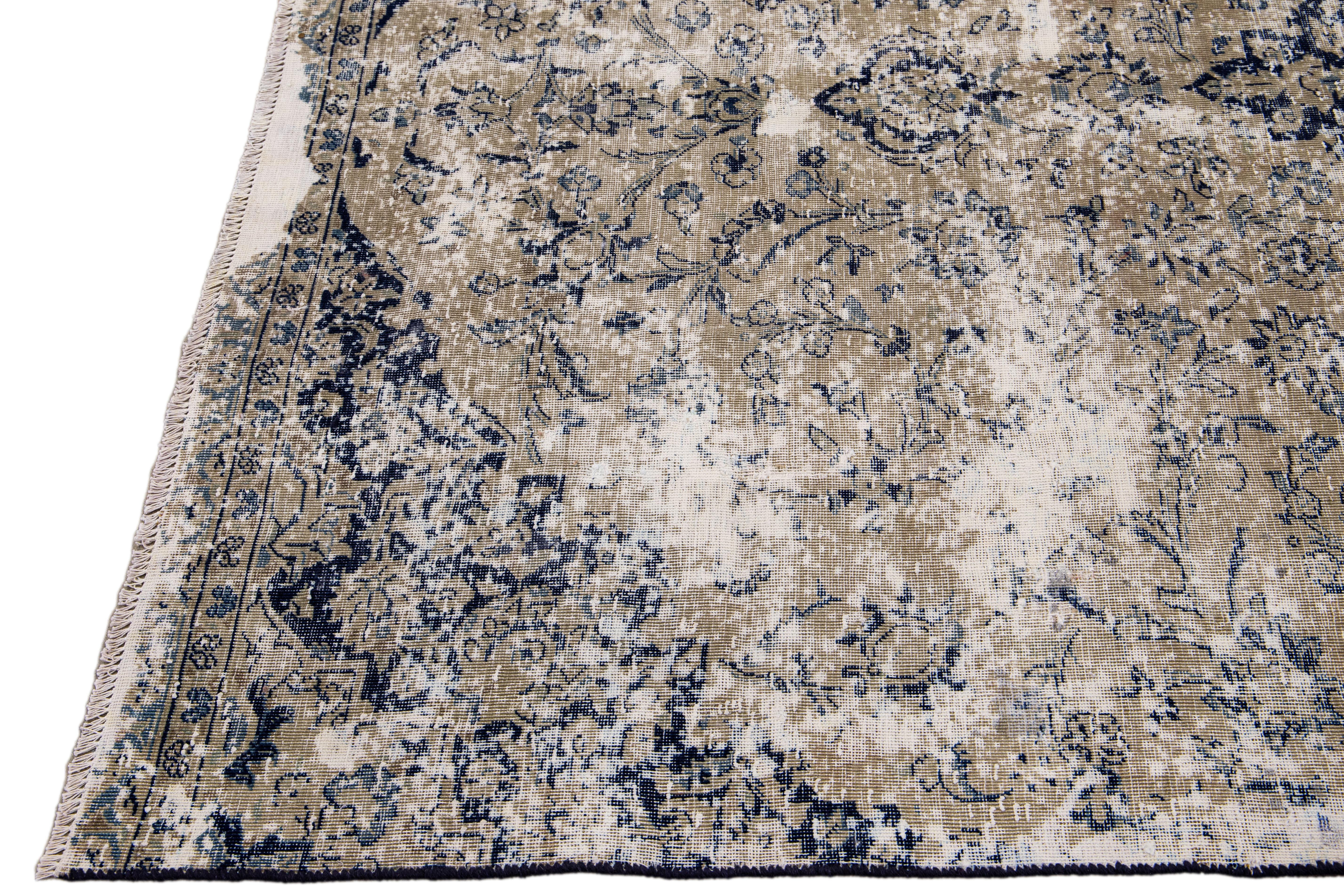 Persian Vintage Handmade Medallion Motif Tan and Blue Distressed Wool Rug For Sale