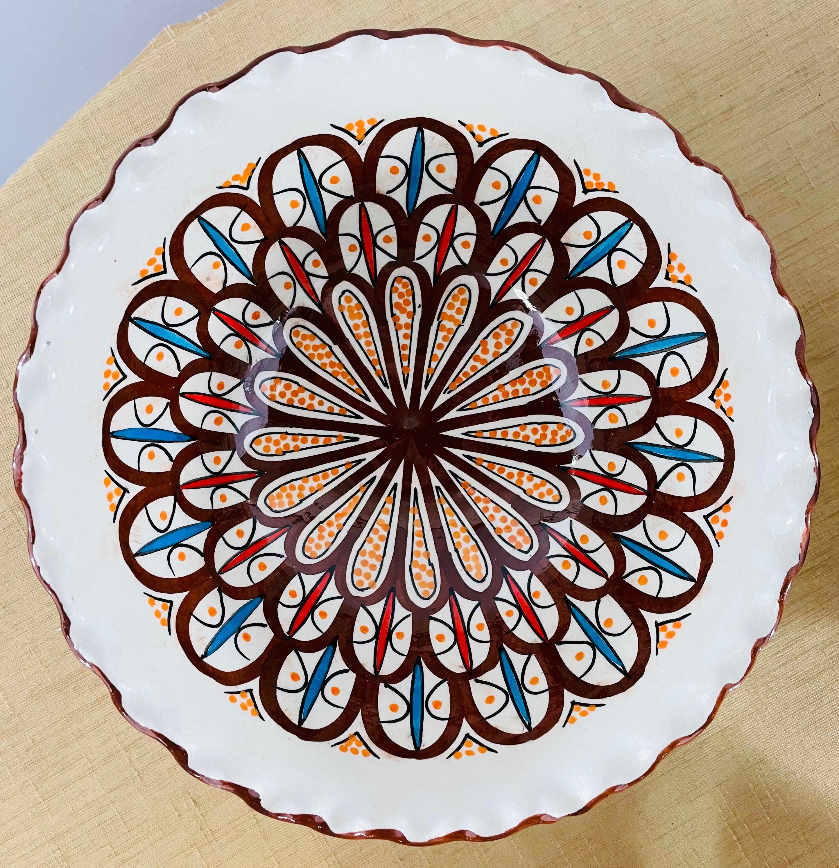 These stunning bowls feature an arabesque pattern and an entrancing fusion of color in white and brown handcrafted in the coastal city of Safi in Moroccan, which is renowned for its high-quality pottery, and ceramic art, they can be wall mounted to