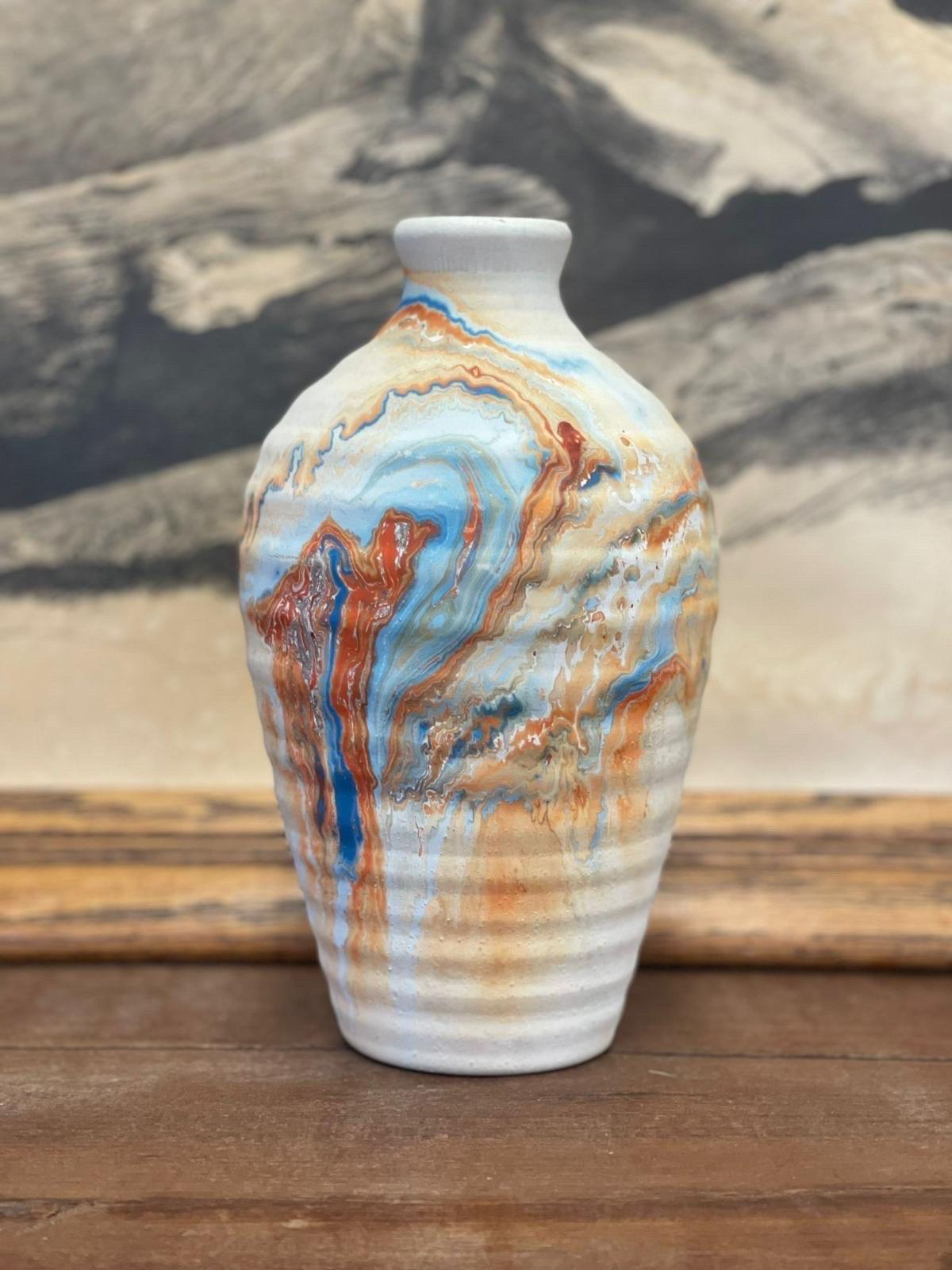 Vintage Handmade Nemadji Vase Minnesota Multicolored Stamped ceramic vase antique pottery orange and blue designed decor

Dimensions. 5 W ; 5 D ; 8 1/2 H