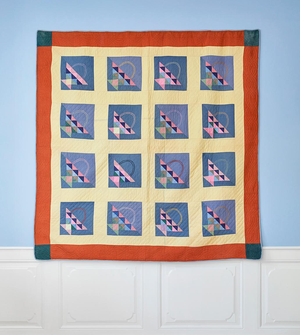 USA, 1920s

Beautiful handmade quilt in tones of blue, pale yellow and red, decorated with the shapes of baskets. 

H 196 x W 193 cm