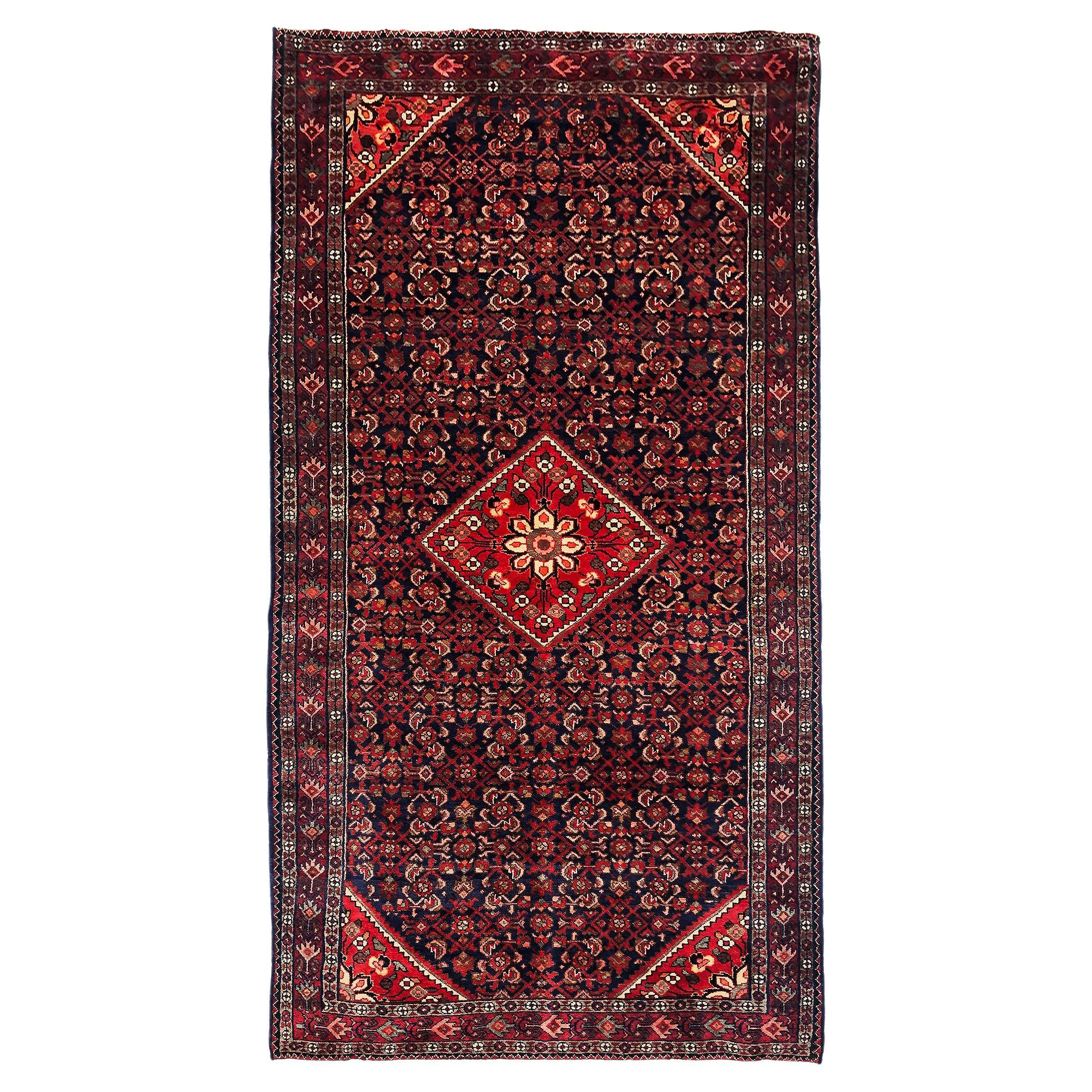 Tapis de sol persan vintage fait main Hosseinabad en laine avec médaillon rouge et bleu, années 1990 en vente