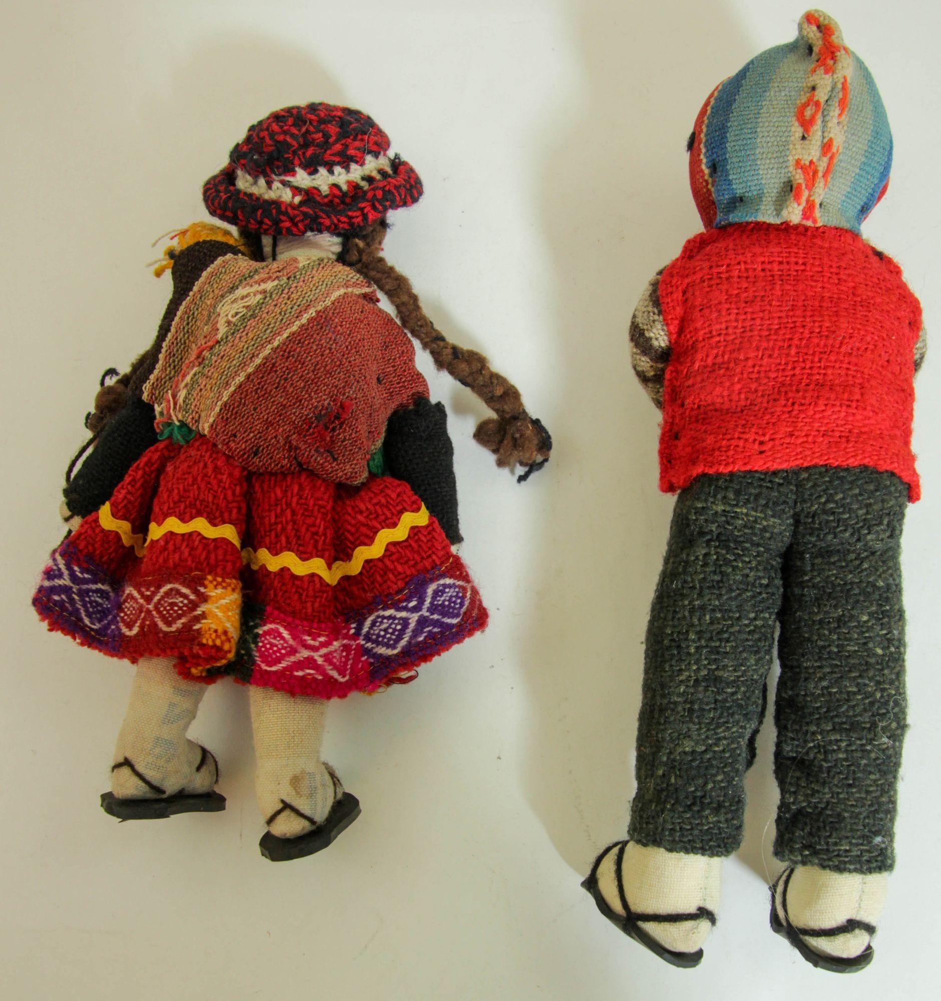 Vintage Handcrafted Peruvian Couple Folk Art Collectible Dolls.
Handmade vintage collectible Cusco Peruvian dolls feature stuffed bodies, sewn-on faces, and braided black yarn hair.
They wear traditional cotton and wool garments, representing the