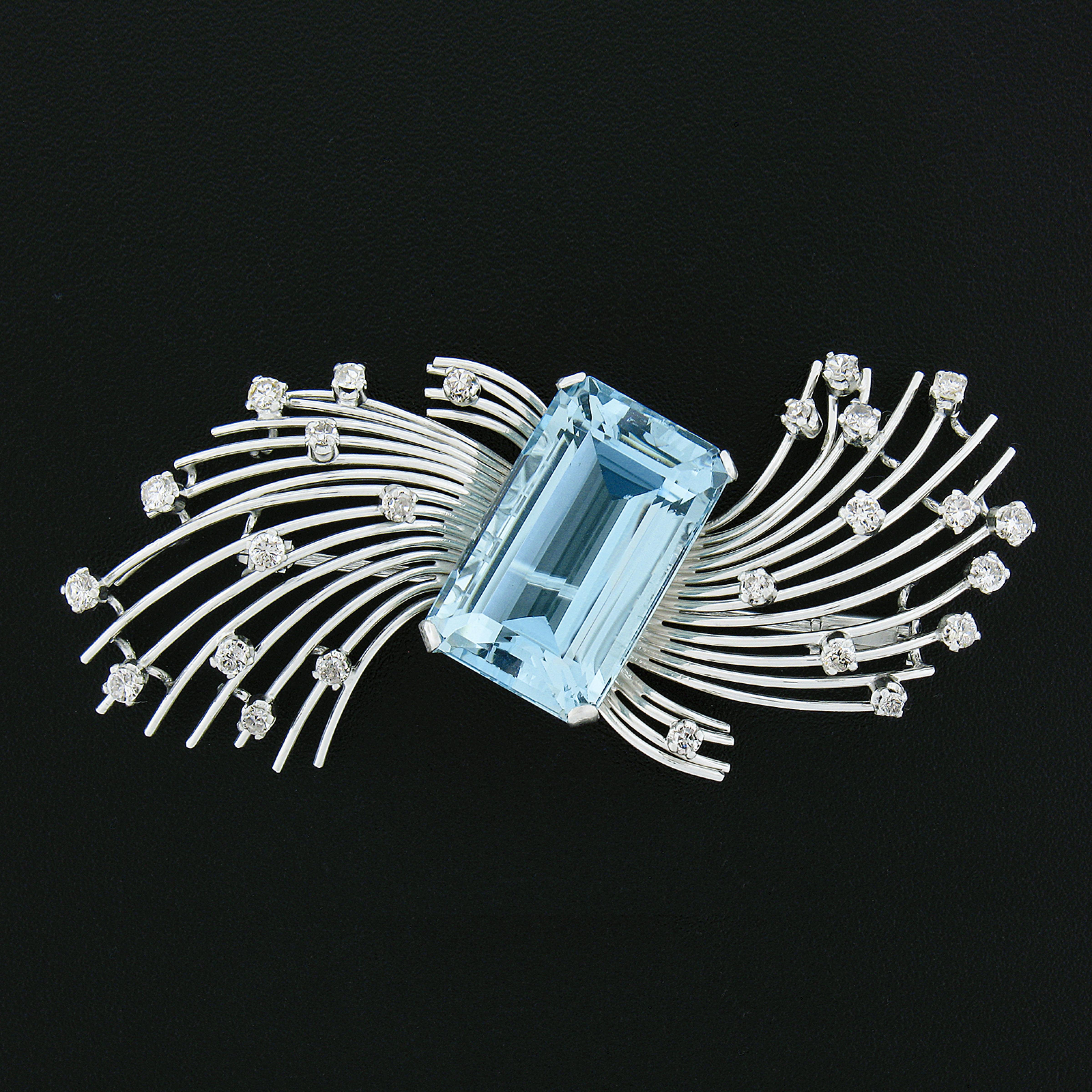 Here we have a magnificent vintage brooch that was hand crafted from solid platinum. The brooch features a large, approximately 19.65 carat, GIA certified, natural aquamarine neatly prong set at the center of the beautiful handmade wire design. The