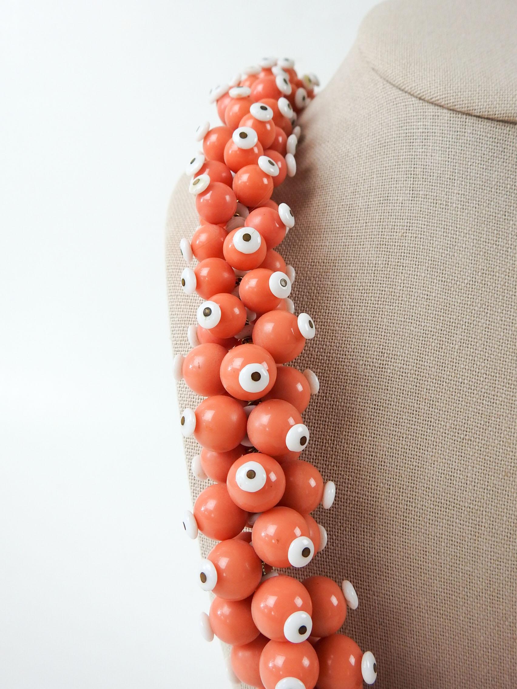 Circa 1960's bold dimensional salmon and white graduated beaded necklace. Measures 27