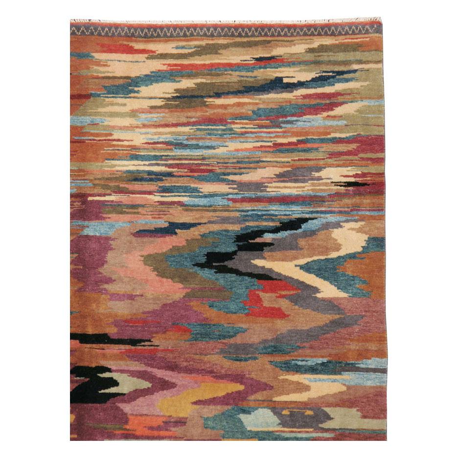A vintage Turkish Anatolian 5' x 8' accent rug handmade during the late 20th century. Featuring a whimsical and abstract zig-zag pattern with nautical Folk Art elements on the lower half, the weaver intended to create a pictorial carpet of a