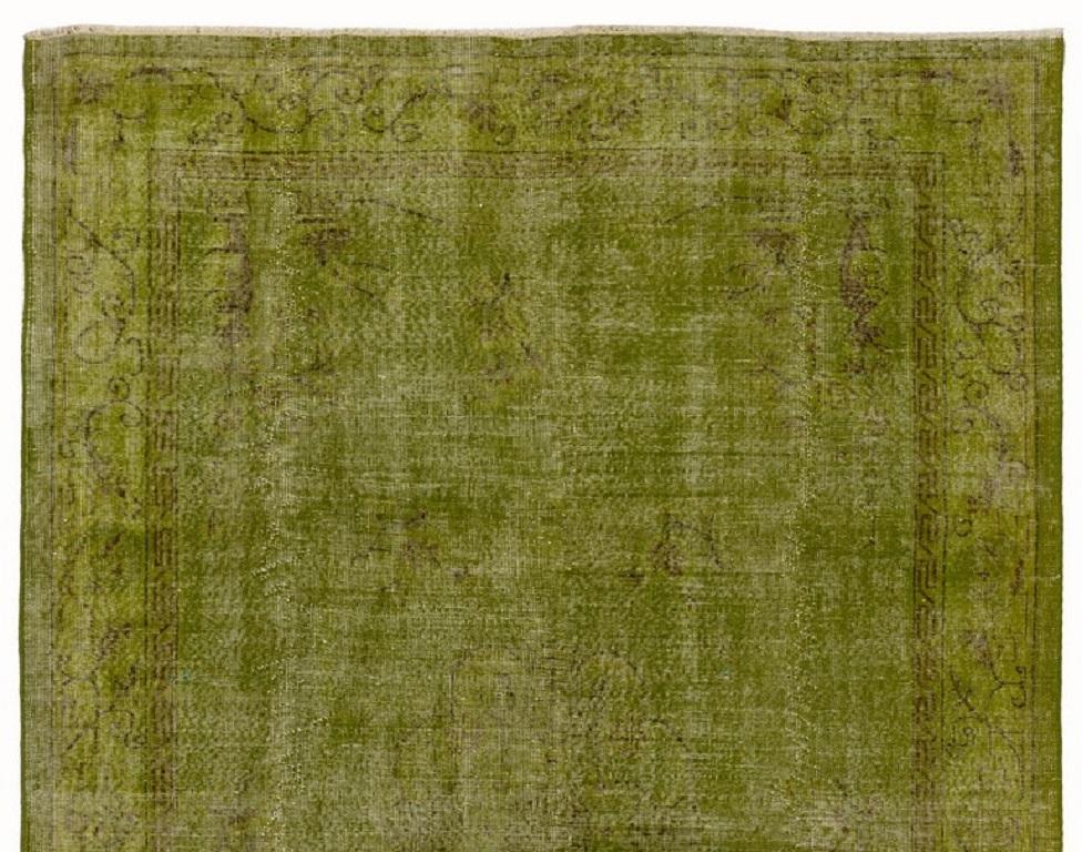 A vintage handmade Turkish area rug with an Art Deco Chinese design, over-dyed in dark chartreuse color.
The rug is finely hand knotted with low wool pile on cotton foundation. It is deep-washed, sturdy, and can be used on a high traffic area.
