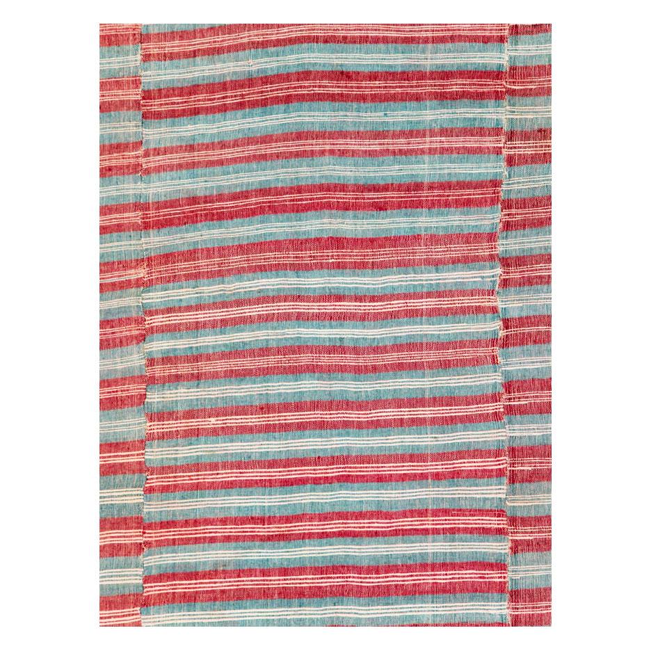A vintage Turkish flat-weave Kilim accent rug handmade during the mid-20th century.

Measures: 6'6
