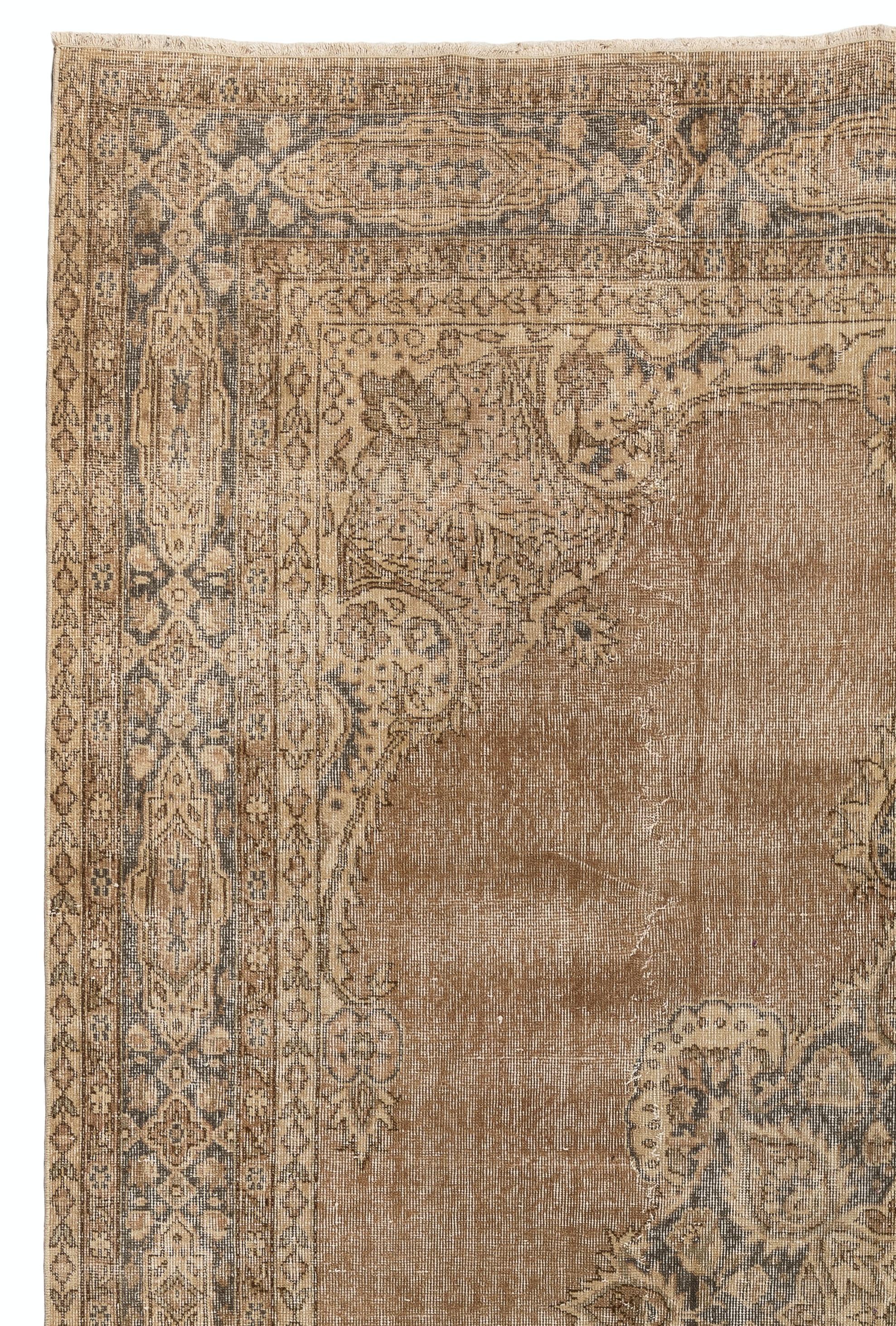 This vintage hand-knotted Turkish rug measures 7.6 x 10.5 ft. 
Dates back to 1950s. It features a  delicate medallion design, cream ground spandrels decorated with leaves, blossoms and branches  and framed with a gray ground geometric main border.