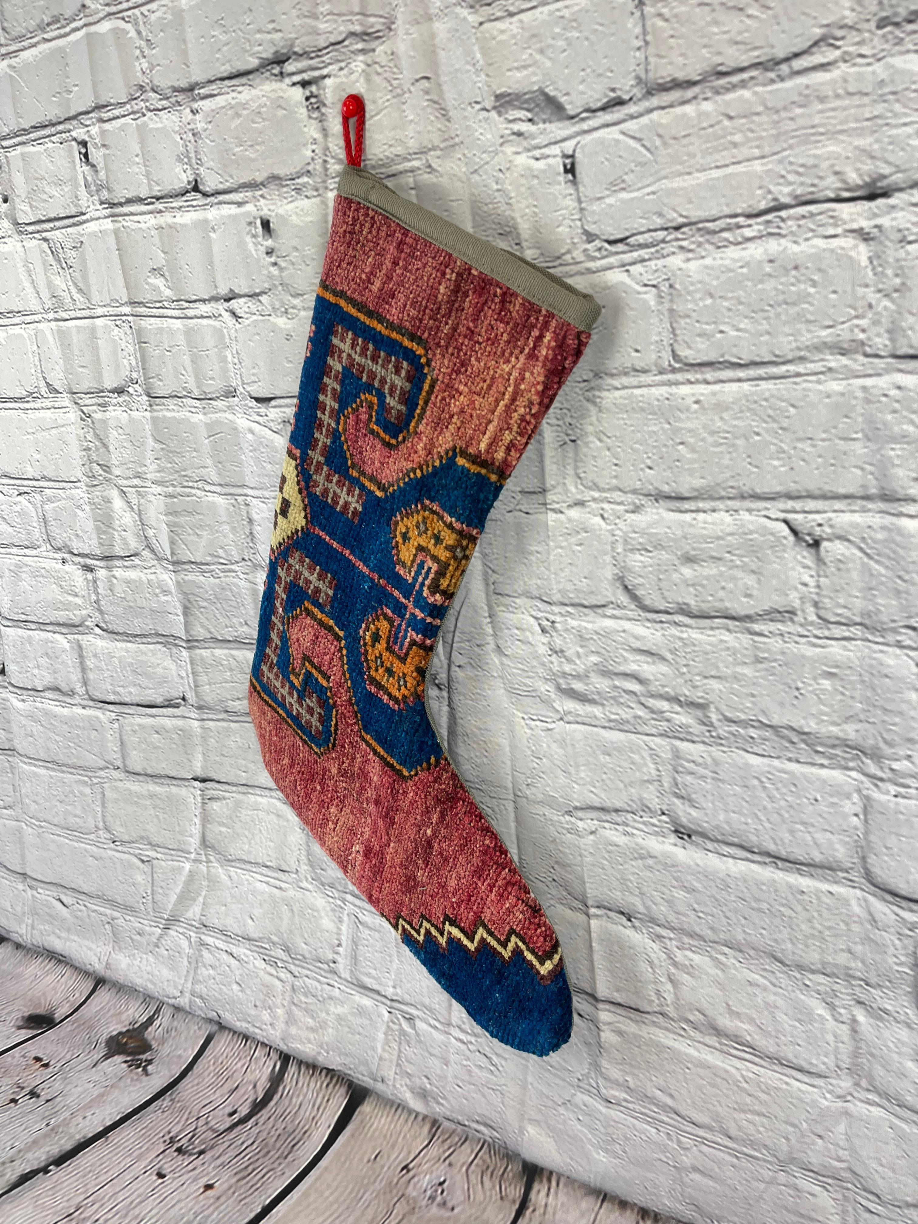 Handmade
Vintage from the 1960s
Materials: wool, cotton

Sustainable, upcycled Turkish rug Christmas stocking made from hand-woven rug fragments. 
Width: 13 inches
Height: 17 inches
Christmas Stocking
Turkish Rug Stocking
Handmade Stocking
Vintage