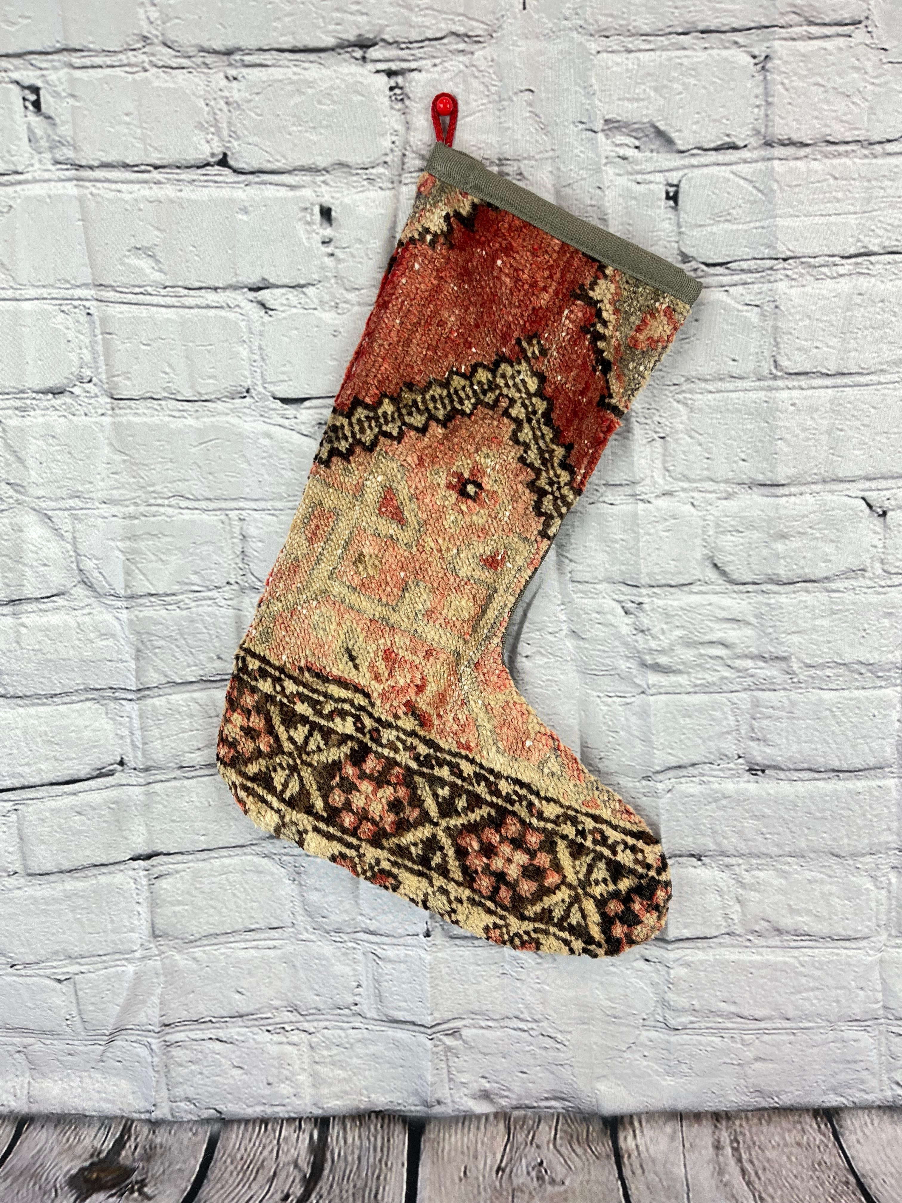 Handmade
Vintage from the 1960s
Materials: wool, cotton

Sustainable, upcycled Turkish rug Christmas stocking made from hand-woven rug fragments. 
Width: 13 inches
Height: 17 inches
Christmas Stocking
Turkish Rug Stocking
Handmade Stocking
Vintage