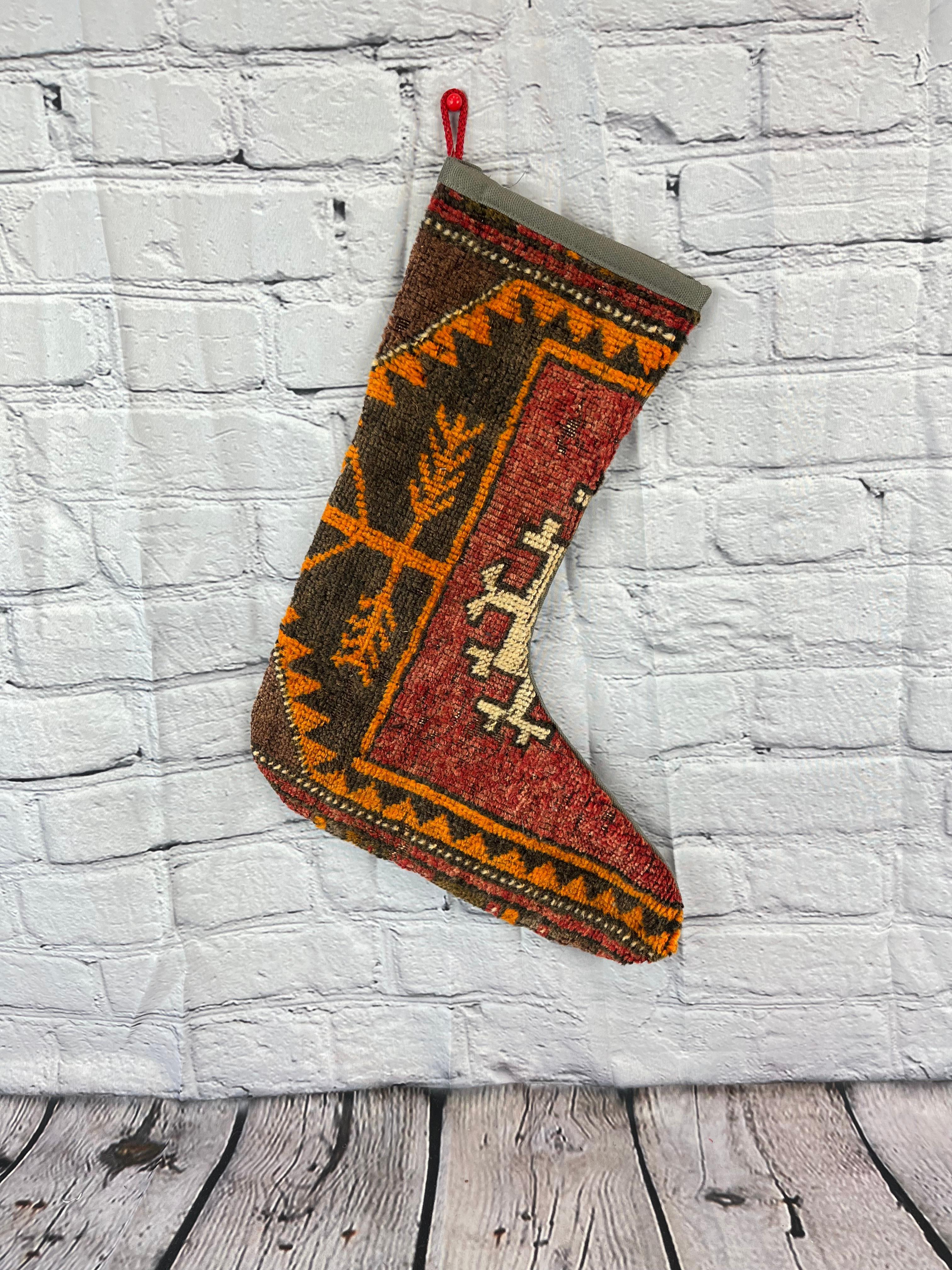 Handmade
Vintage from the 1960s
Materials: wool, cotton

Sustainable, upcycled Turkish rug Christmas stocking made from hand-woven rug fragments. 
Width: 13 inches
Height: 17 inches
Christmas Stocking
Turkish Rug Stocking
Handmade Stocking
Vintage