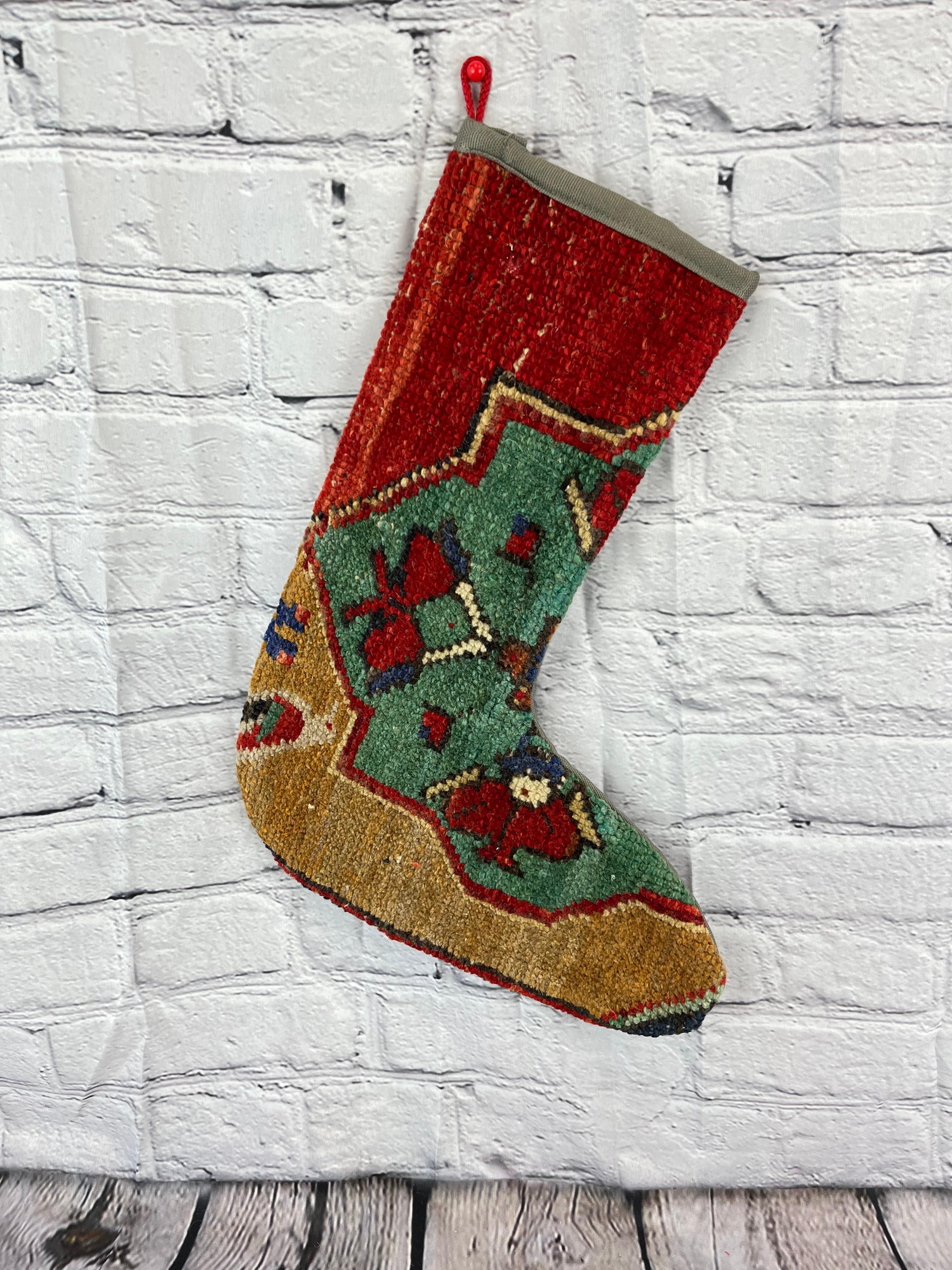 Handmade
Vintage from the 1960s
Materials: wool, cotton

Sustainable, upcycled Turkish rug Christmas stocking made from hand-woven rug fragments. 
Width: 13 inches
Height: 17 inches
Christmas Stocking
Turkish Rug Stocking
Handmade Stocking
Vintage