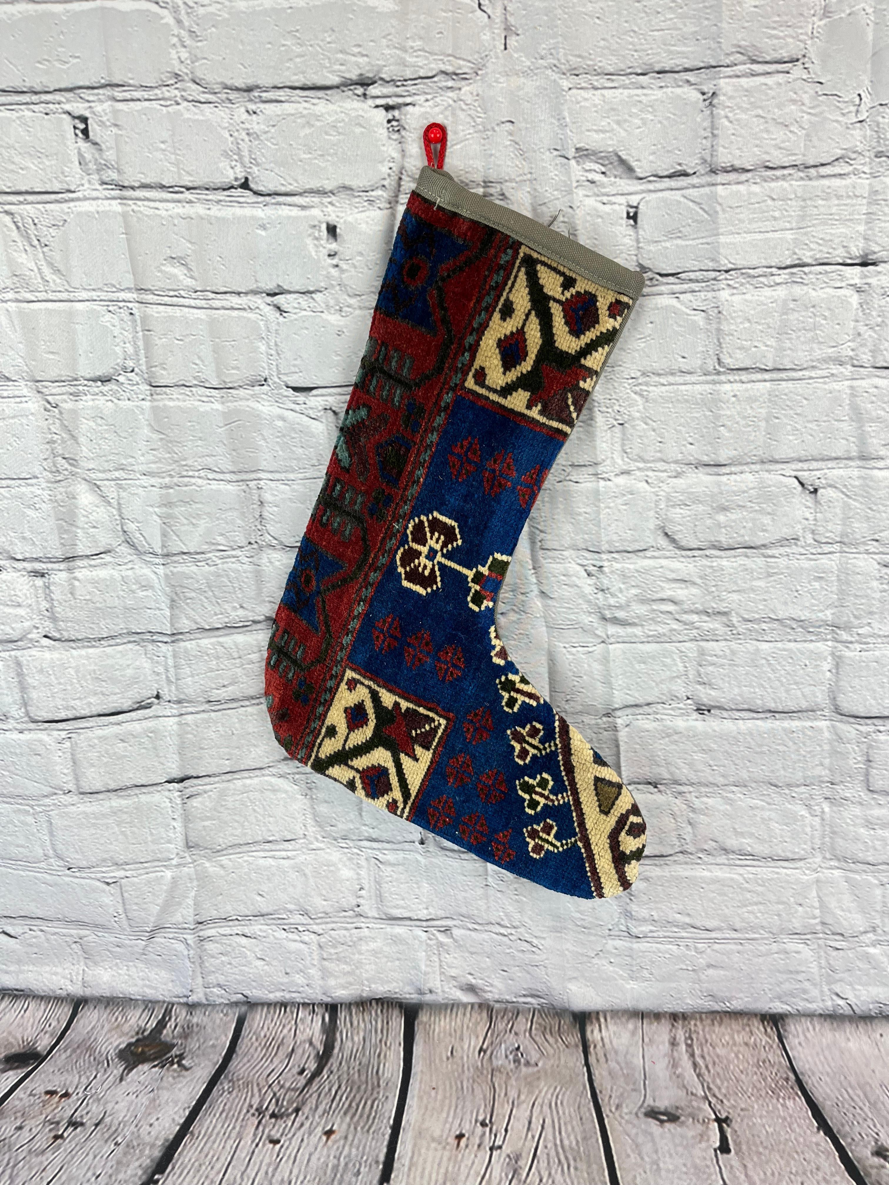 Handmade
Vintage from the 1960s
Materials: wool, cotton

Sustainable, upcycled Turkish rug Christmas stocking made from hand-woven rug fragments. 
Width: 13 inches
Height: 17 inches
Christmas Stocking
Turkish Rug Stocking
Handmade Stocking
Vintage