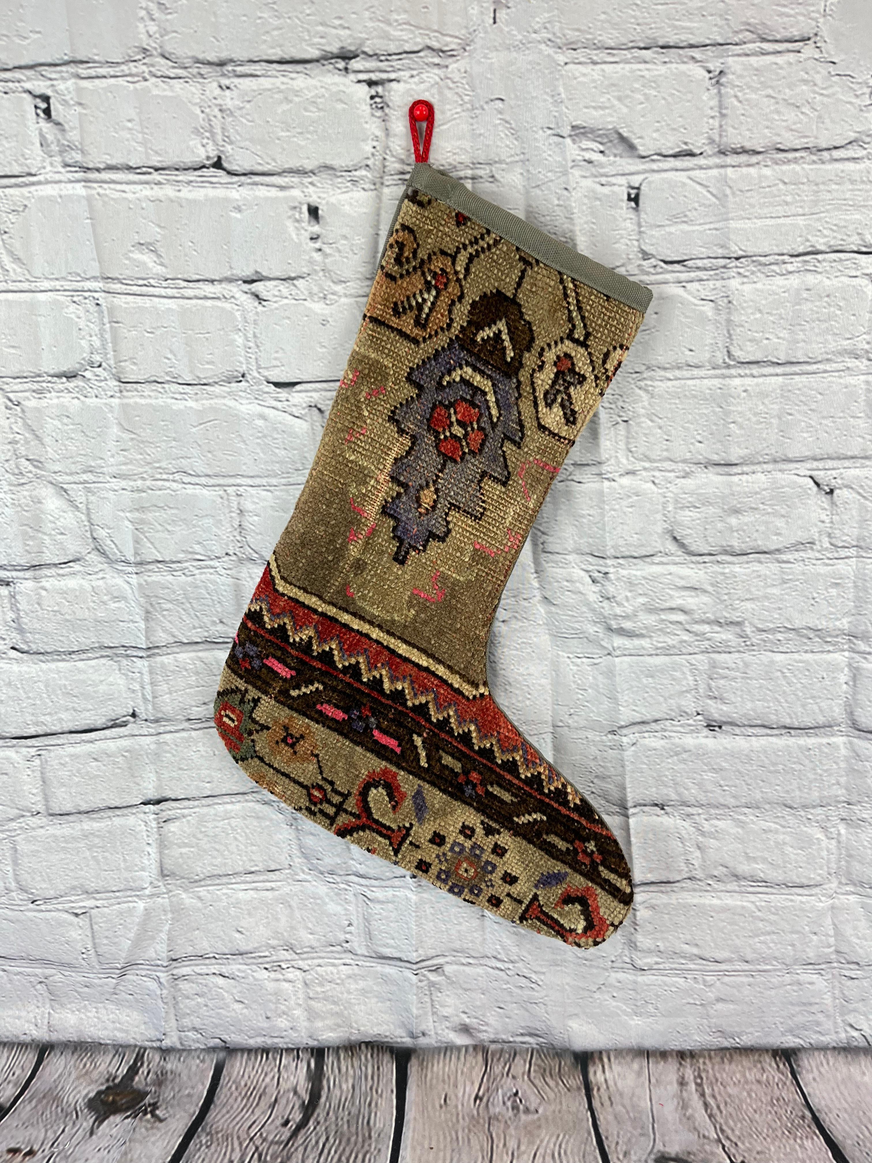 Handmade
Vintage from the 1960s
Materials: wool, cotton

Sustainable, upcycled Turkish rug Christmas stocking made from hand-woven rug fragments. 
Width: 13 inches
Height: 17 inches
Christmas Stocking
Turkish Rug Stocking
Handmade Stocking
Vintage