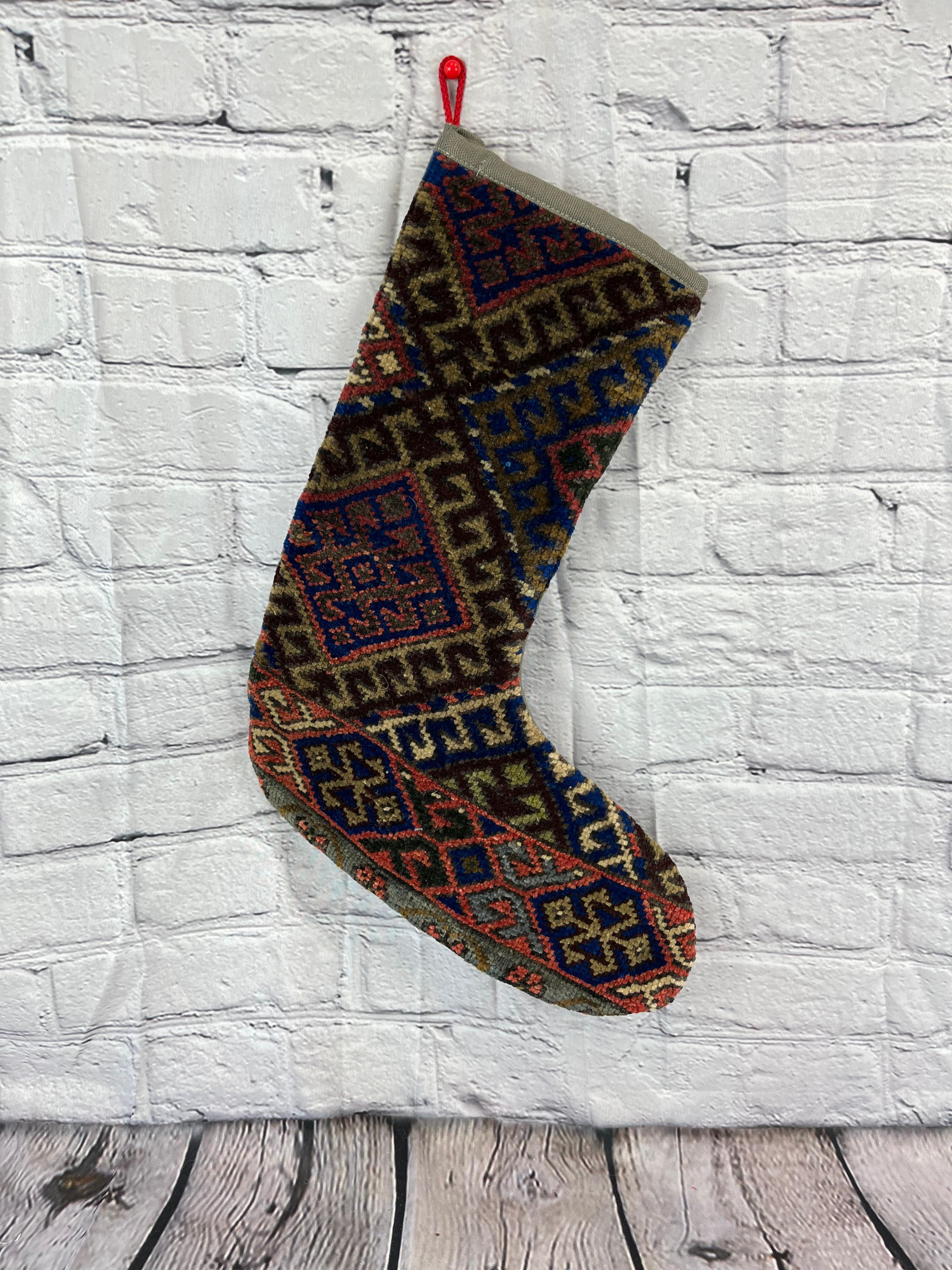 Handmade
Vintage from the 1960s
Materials: wool, cotton

Sustainable, upcycled Turkish rug Christmas stocking made from hand-woven rug fragments. 
Width: 13 inches
Height: 17 inches
Christmas Stocking
Turkish Rug Stocking
Handmade Stocking
Vintage