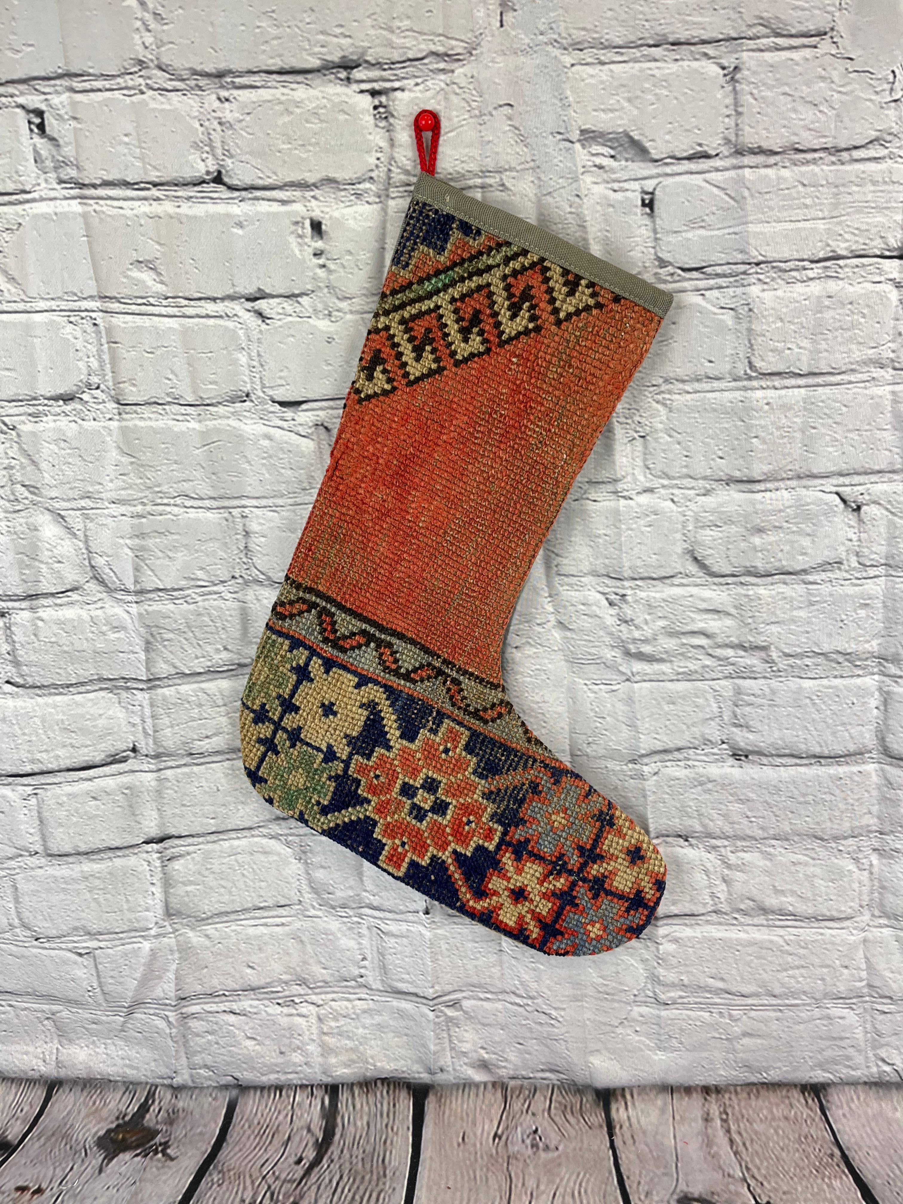 Handmade
Vintage from the 1960s
Materials: wool, cotton

Sustainable, upcycled Turkish rug Christmas stocking made from hand-woven rug fragments. 
Width: 13 inches
Height: 17 inches
Christmas Stocking
Turkish Rug Stocking
Handmade Stocking
Vintage