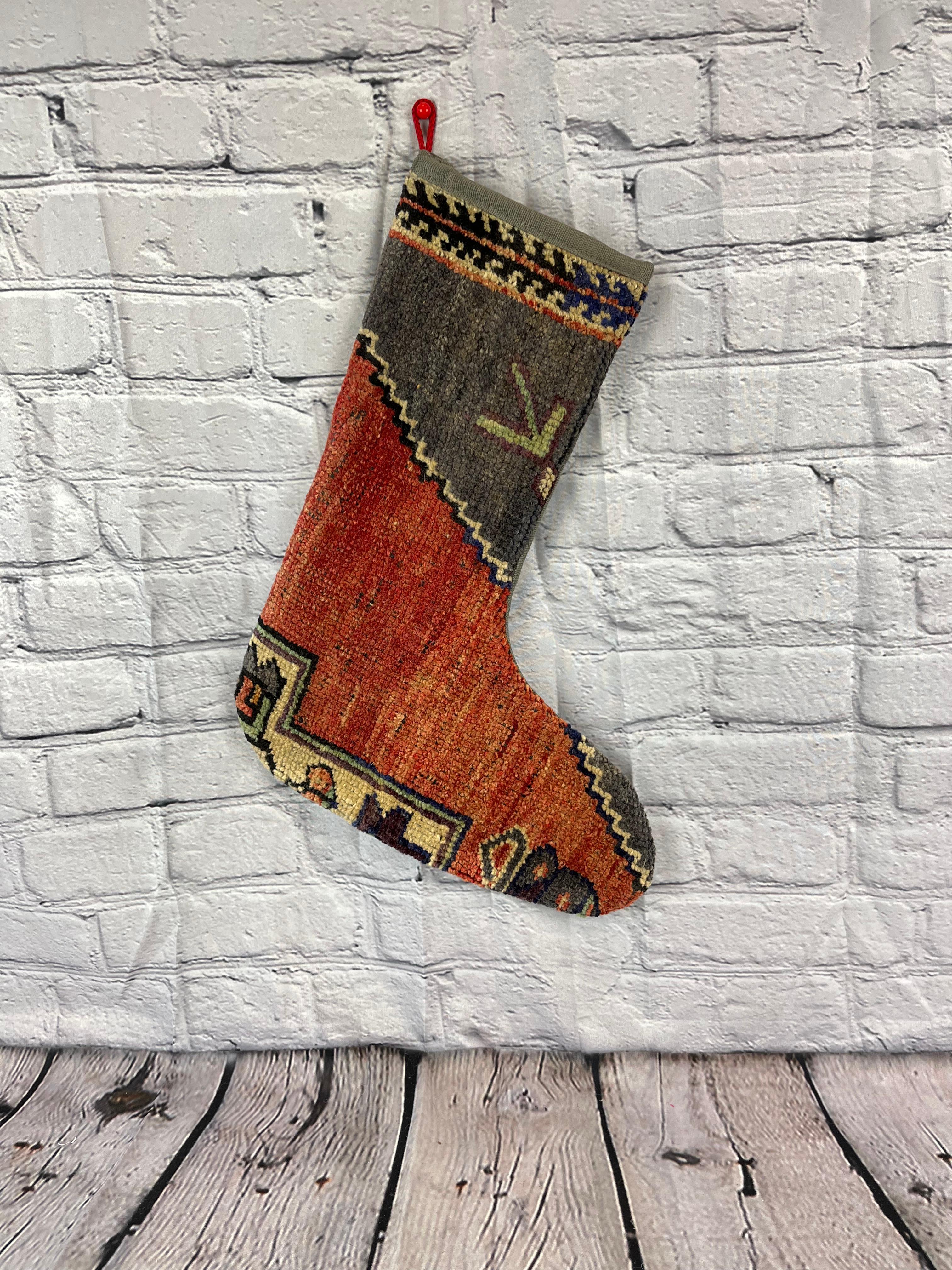 Handmade
Vintage from the 1960s
Materials: wool, cotton

Sustainable, upcycled Turkish rug Christmas stocking made from hand-woven rug fragments. 
Width: 13 inches
Height: 17 inches
Christmas Stocking
Turkish Rug Stocking
Handmade Stocking
Vintage