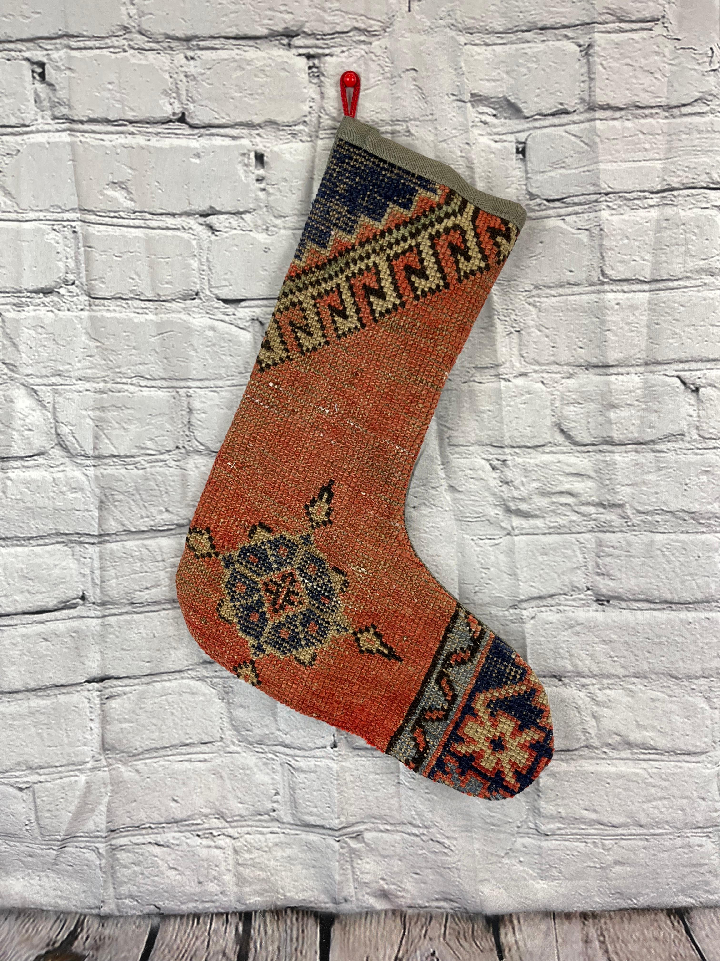 Handmade
Vintage from the 1960s
Materials: wool, cotton

Sustainable, upcycled Turkish rug Christmas stocking made from hand-woven rug fragments. 
Width: 13 inches
Height: 17 inches
Christmas Stocking
Turkish Rug Stocking
Handmade Stocking
Vintage