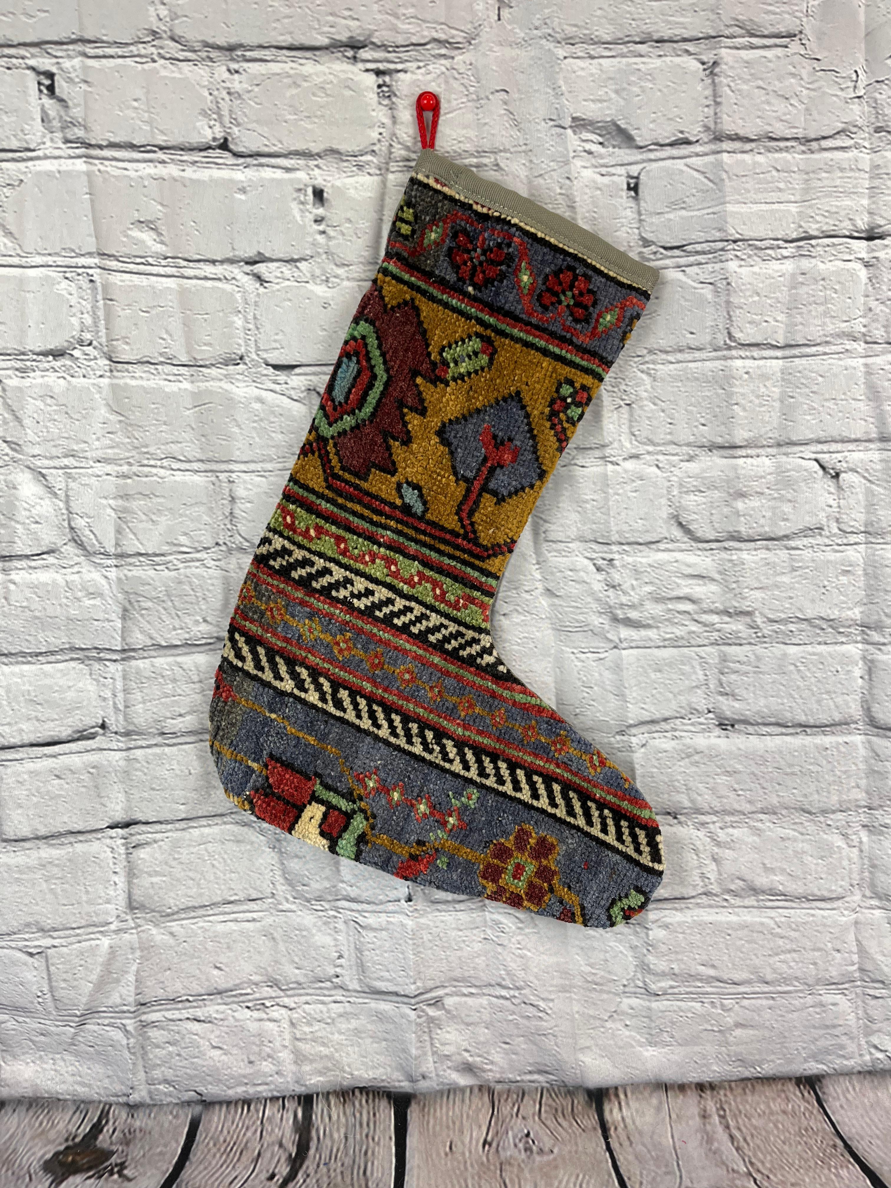 Handmade
Vintage from the 1960s
Materials: wool, cotton

Sustainable, upcycled Turkish rug Christmas stocking made from hand-woven rug fragments. 
Width: 13 inches
Height: 17 inches
Christmas Stocking
Turkish Rug Stocking
Handmade Stocking
Vintage