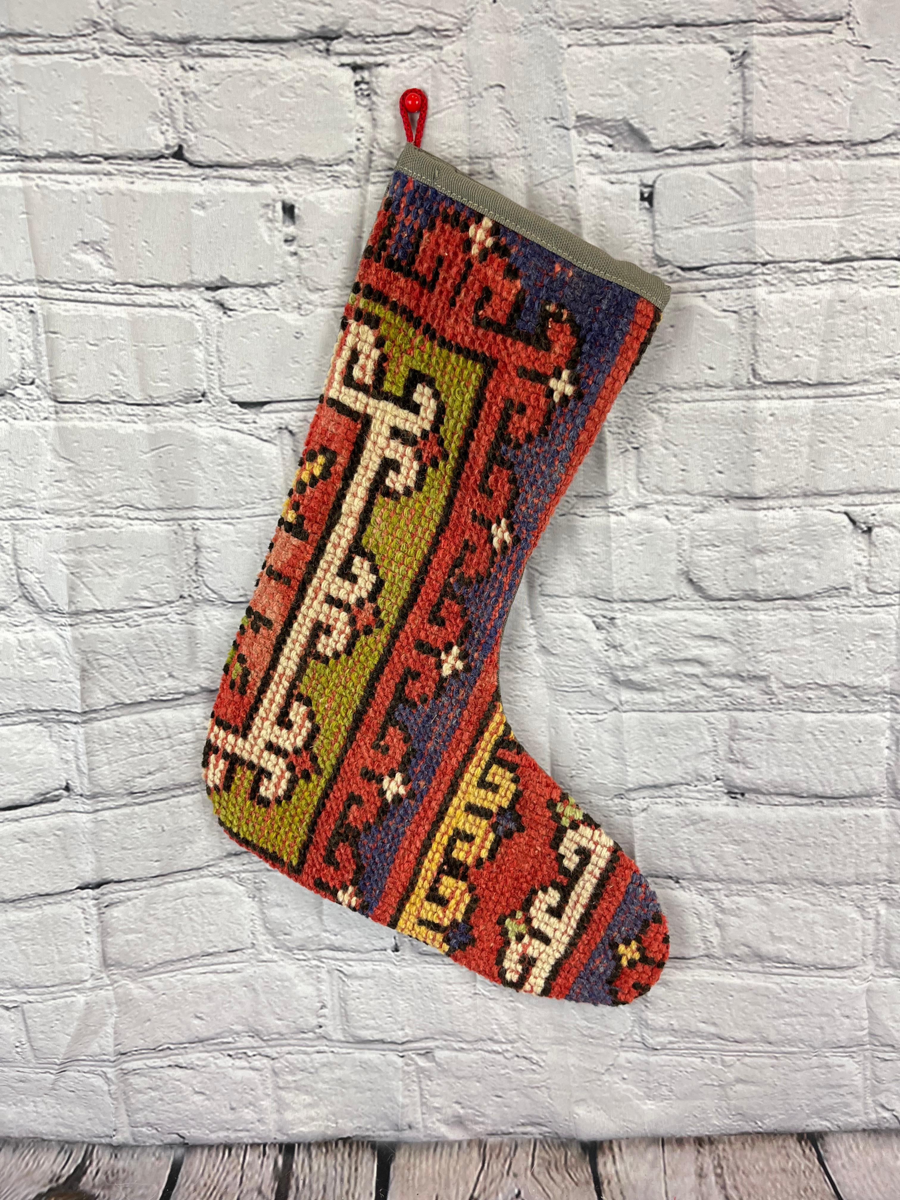 Handmade
Vintage from the 1960s
Materials: wool, cotton

Sustainable, upcycled Turkish rug Christmas stocking made from hand-woven rug fragments. 
Width: 13 inches
Height: 17 inches
Christmas Stocking
Turkish Rug Stocking
Handmade Stocking
Vintage