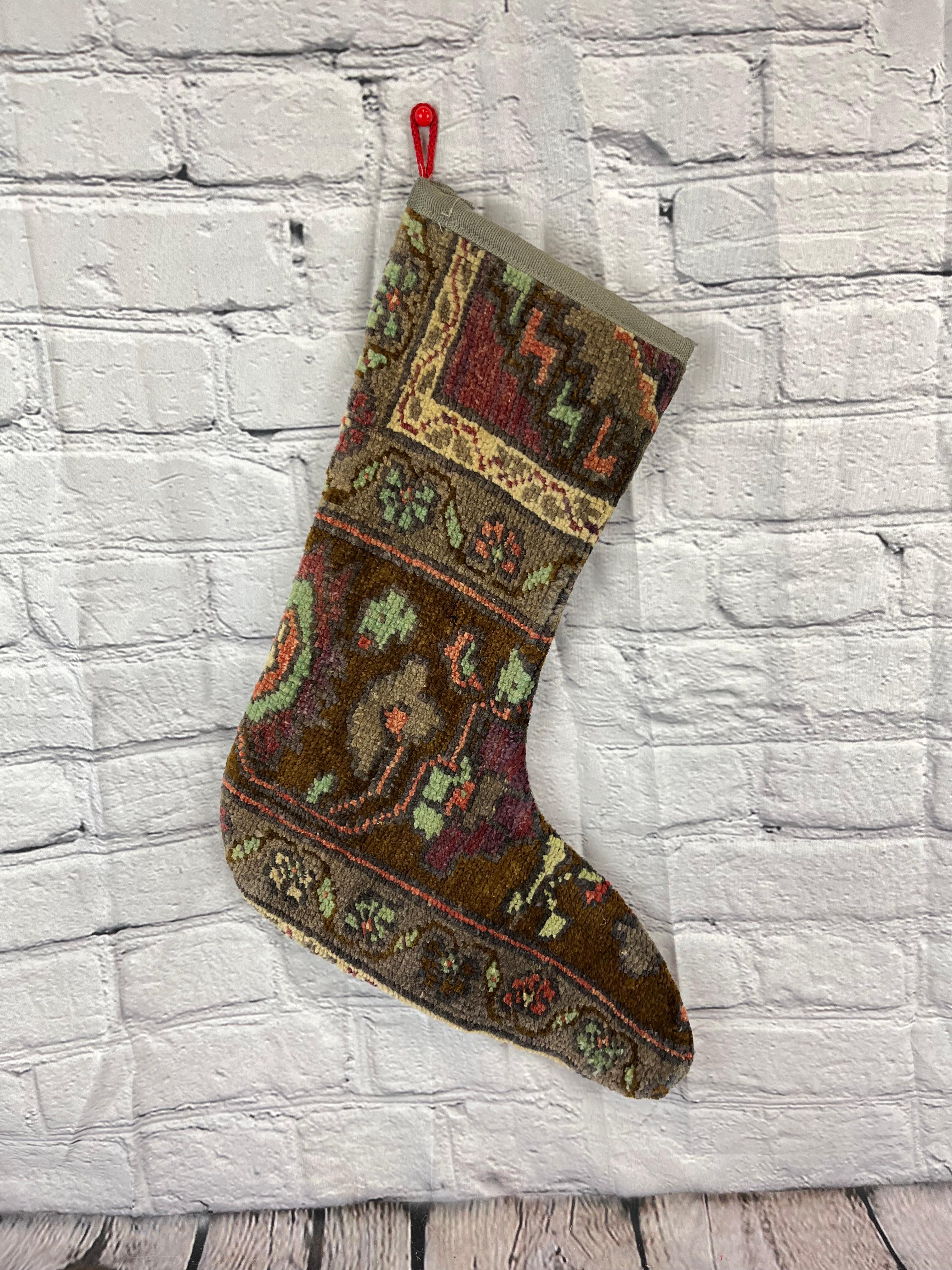 Handmade
Vintage from the 1960s
Materials: wool, cotton

Sustainable, upcycled Turkish rug Christmas stocking made from hand-woven rug fragments. 
Width: 13 inches
Height: 17 inches
Christmas Stocking
Turkish Rug Stocking
Handmade Stocking
Vintage