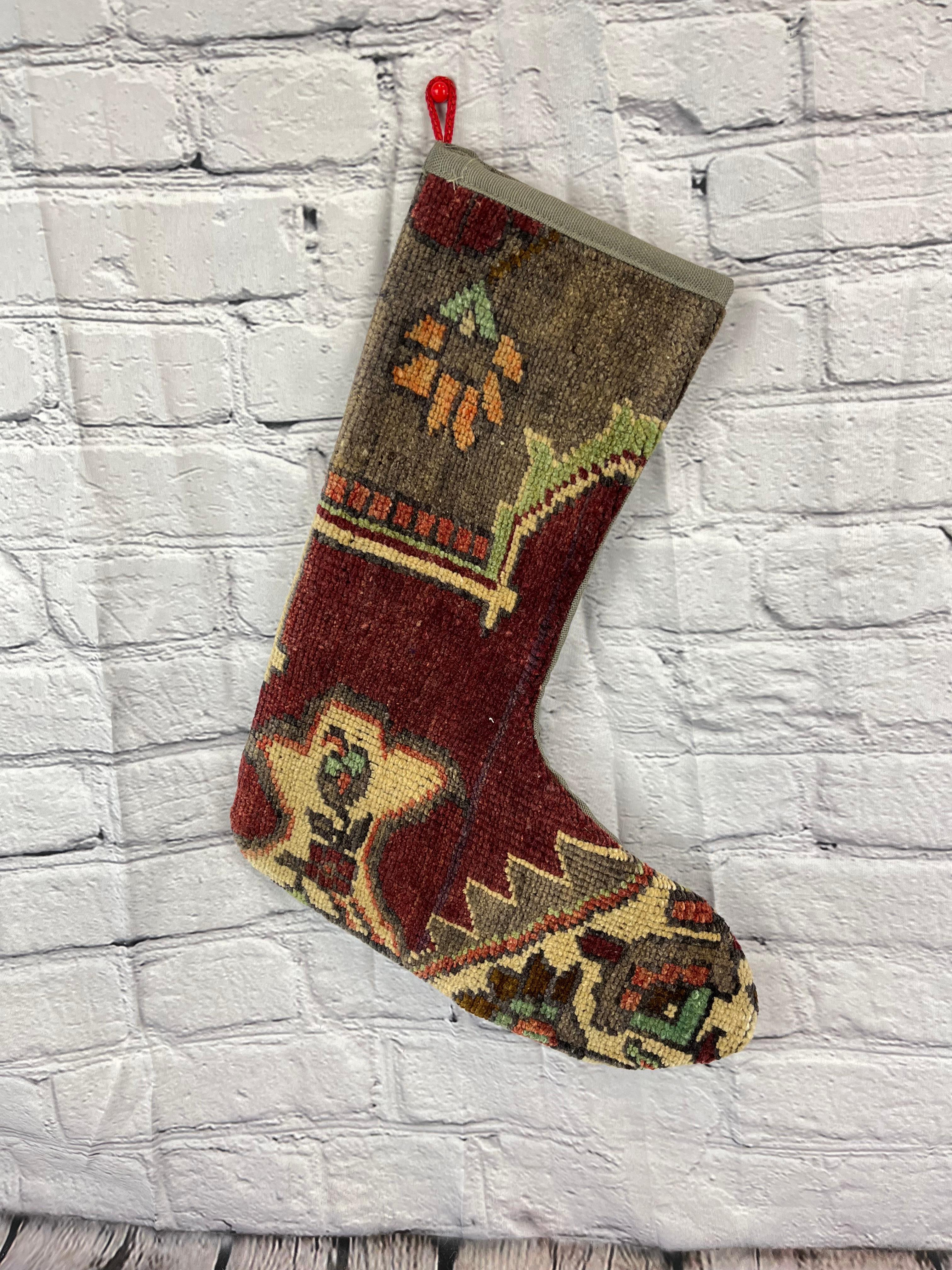 Handmade
Vintage from the 1960s
Materials: wool, cotton

Sustainable, upcycled Turkish rug Christmas stocking made from hand-woven rug fragments. 
Width: 13 inches
Height: 17 inches
Christmas Stocking
Turkish Rug Stocking
Handmade Stocking
Vintage