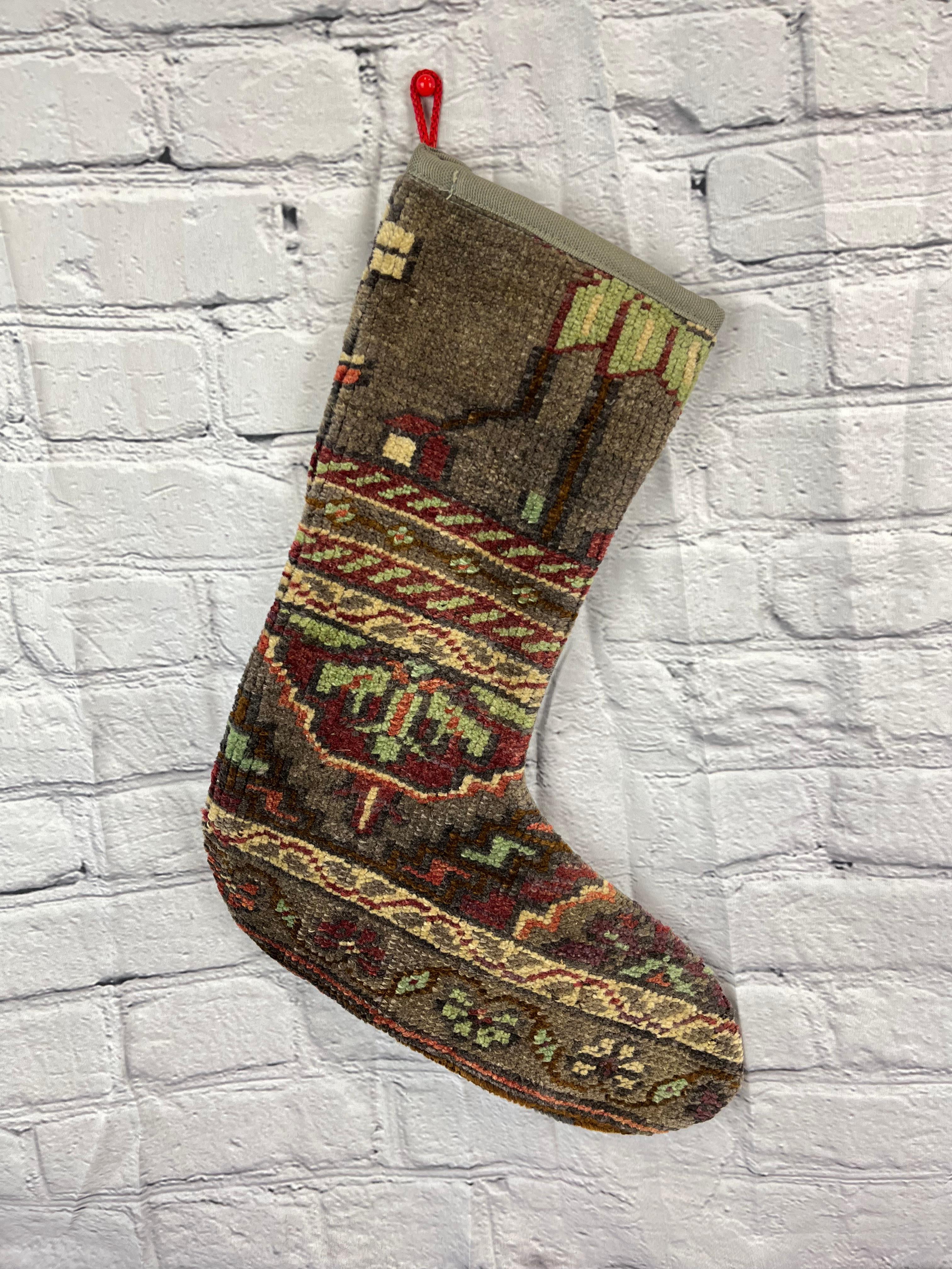 Handmade
Vintage from the 1960s
Materials: wool, cotton

Sustainable, upcycled Turkish rug Christmas stocking made from hand-woven rug fragments. 
Width: 13 inches
Height: 17 inches
Christmas Stocking
Turkish Rug Stocking
Handmade Stocking
Vintage