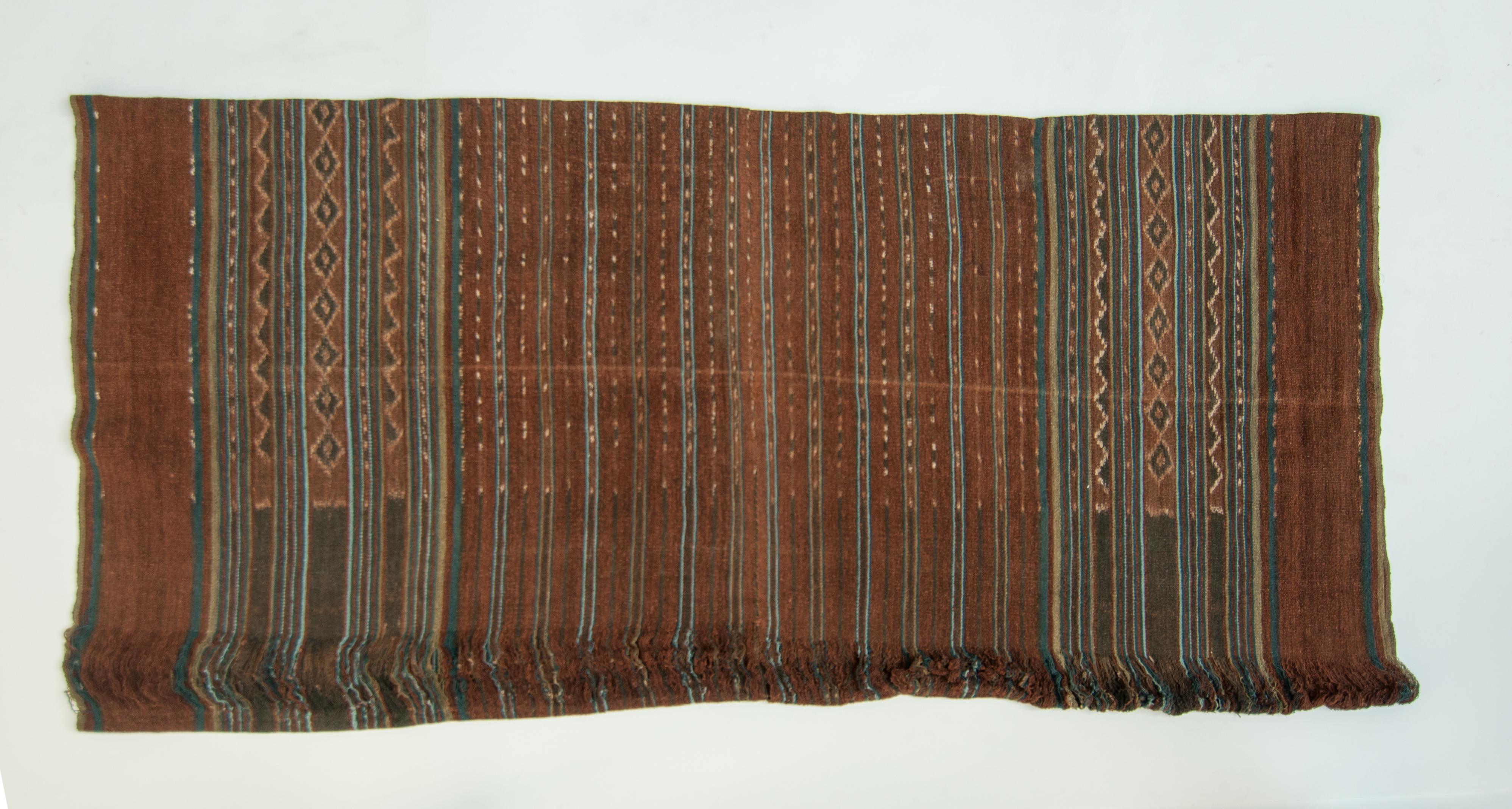 Vintage handspun cotton Ikat. Uncut warp. Lembata, Indonesia. mid-20th century.
This sarong comprises two panels, each woven on a traditional backstrap loom and then sewn together. It was never worn, but was given as part of a wedding gift