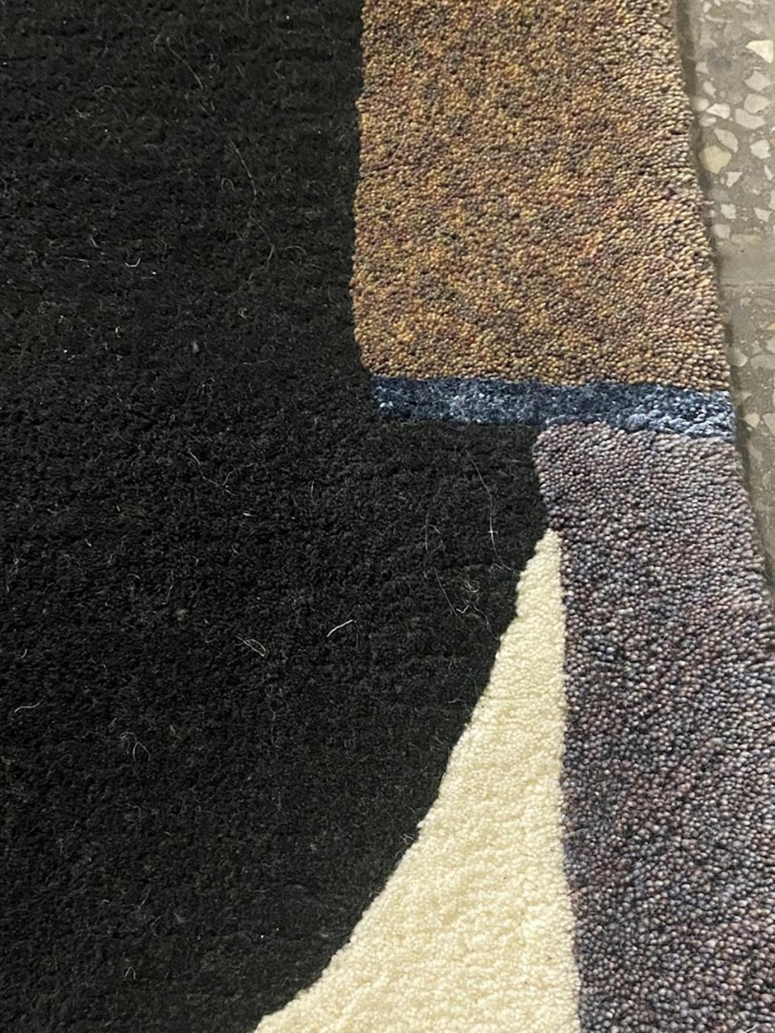 Add a touch of modern elegance to any room with this vintage hand-tufted rug by Tisca. Made in Germany in the 1980s, this rug features a beautiful multicoloured design that is sure to brighten up any space. Measuring 240cm in length and 170cm in