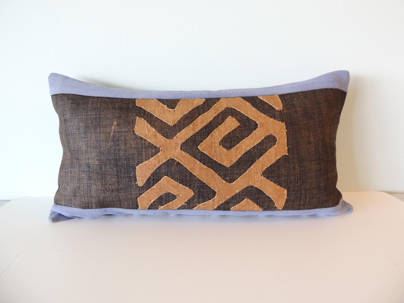 Vintage Kuba Tan and Brown Handwoven African Bolster Decorative Pillow with
antique Wedgewood blue linen backing. 
Handwoven patchwork and appliqué raffia African decorative lumbar pillow with labyrinth pattern.
 Decorative pillow designed and